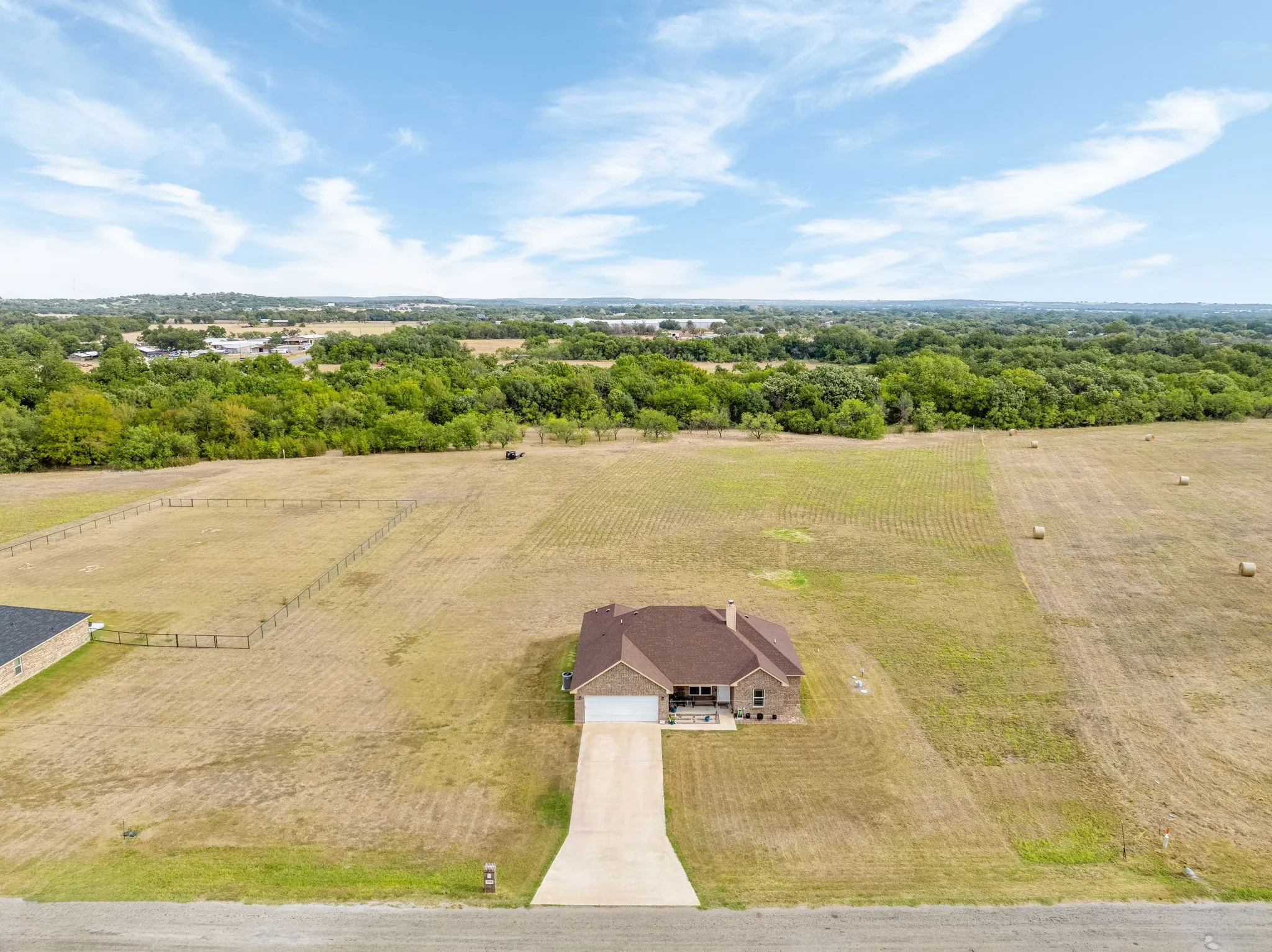 Drone view of the long driveway and acreage
