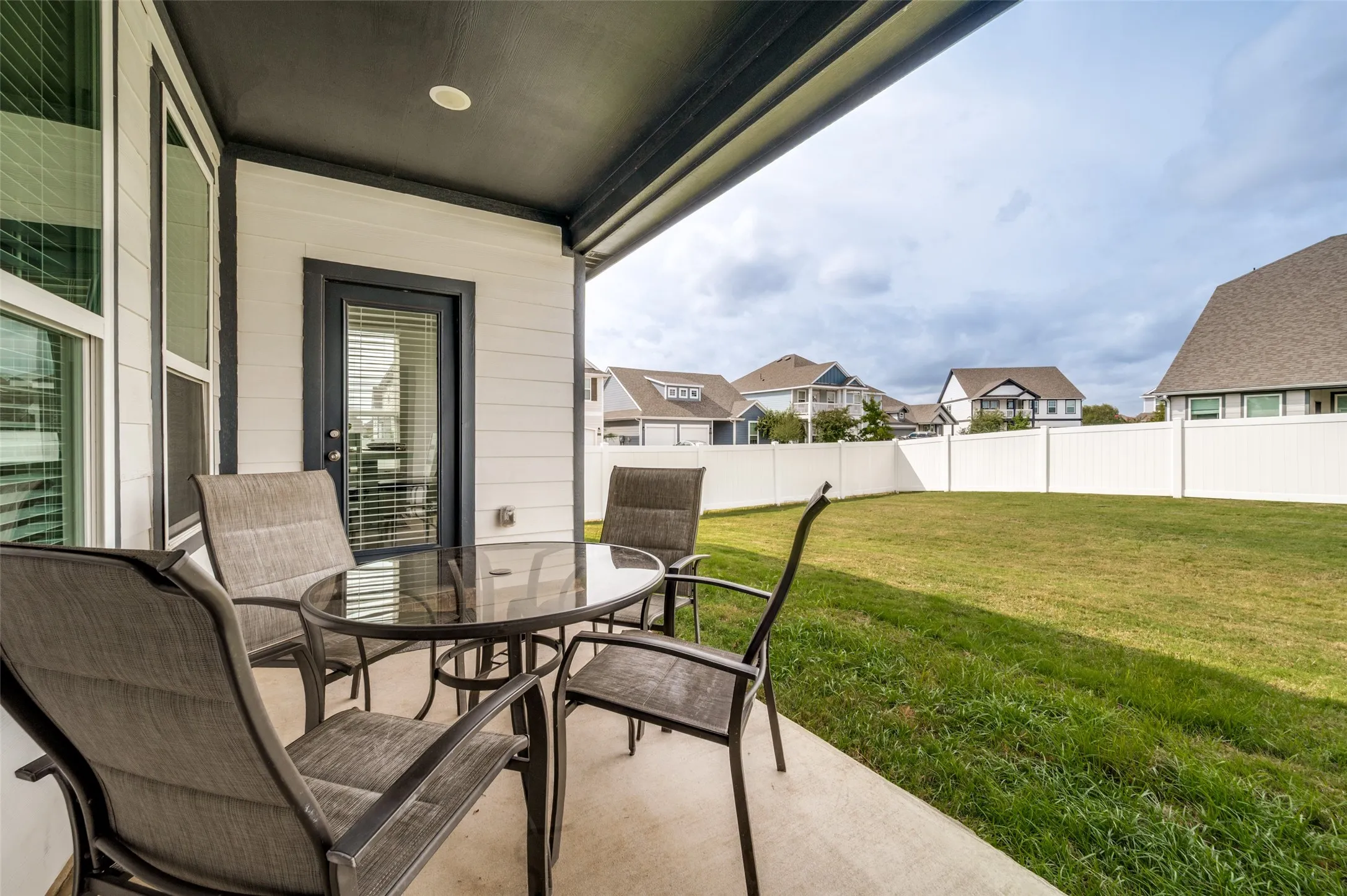 Covered patio with recessed lighting, direct exterior access, and a concrete surface