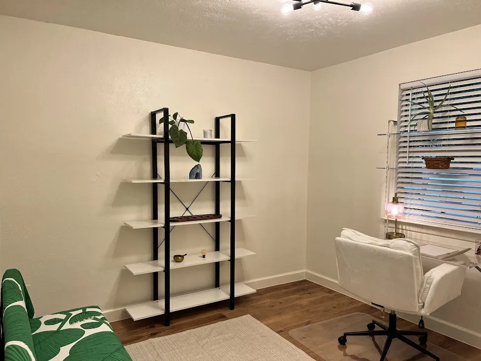 Wood-finish flooring, modern ceiling light fixture, white walls, and a window with blinds