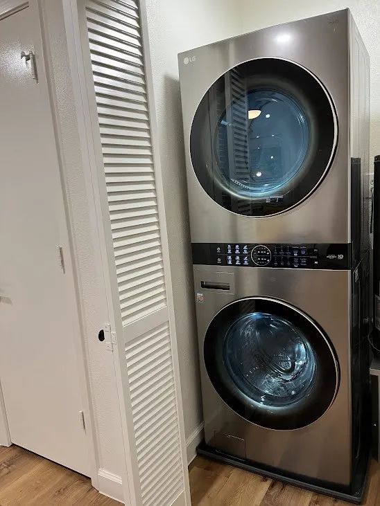 Stainless steel stacked washer and dryer unit