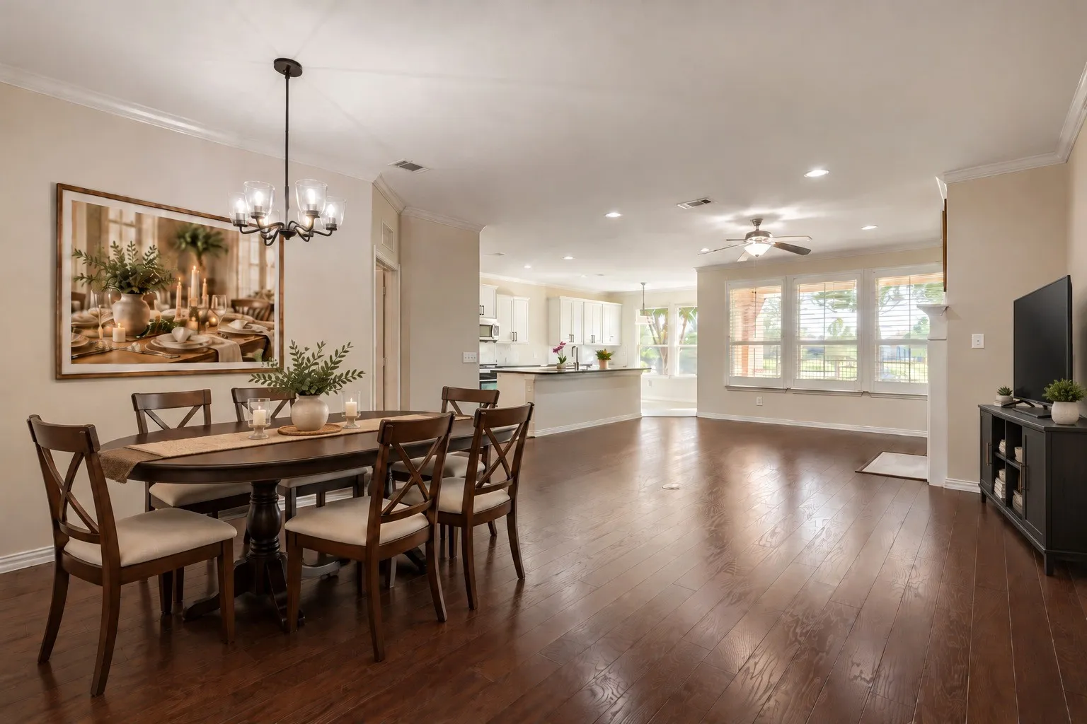 Wood-finish flooring throughout, recessed lighting, and crown molding