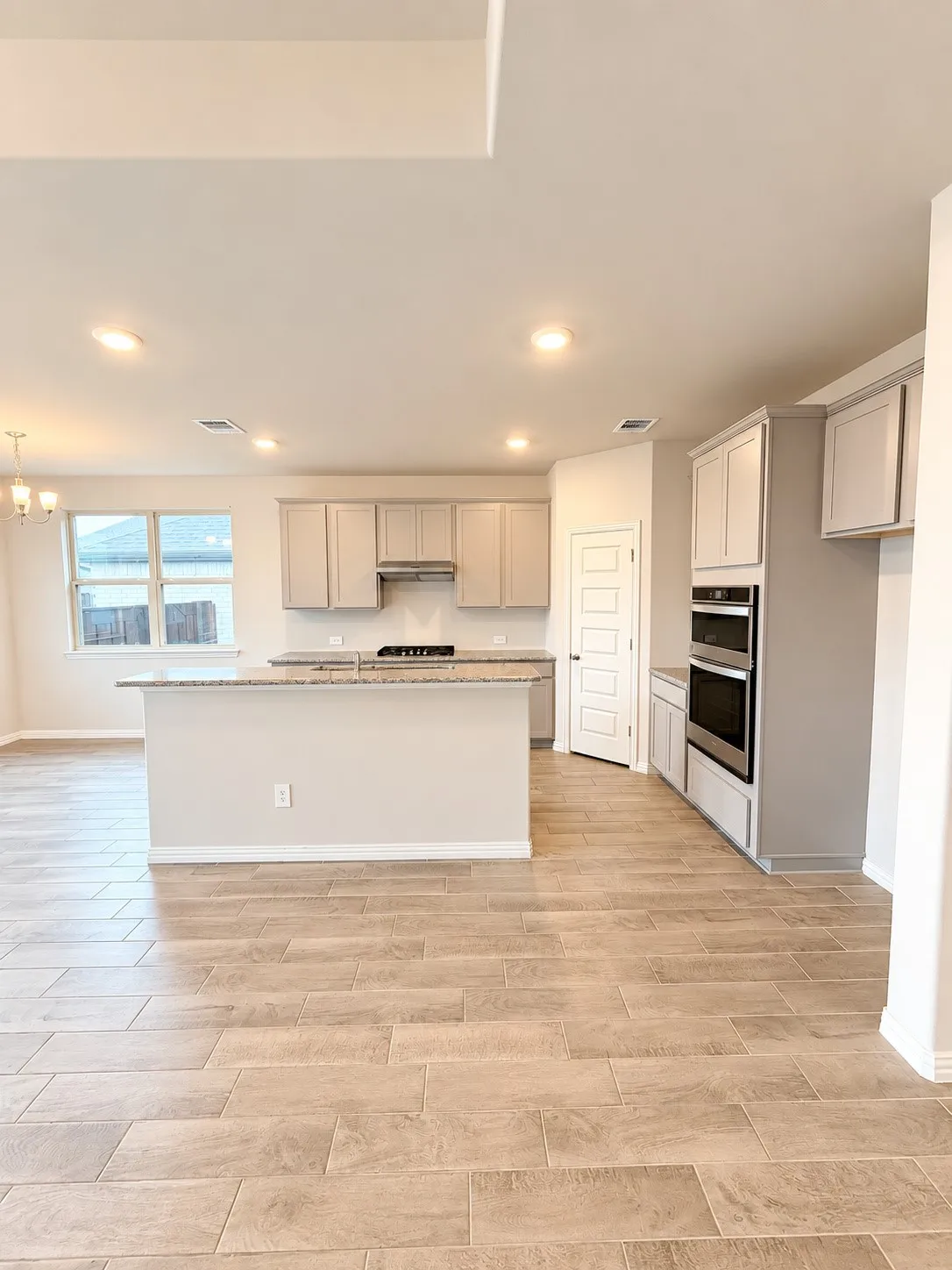 Kitchen featuring an island with stone countertops