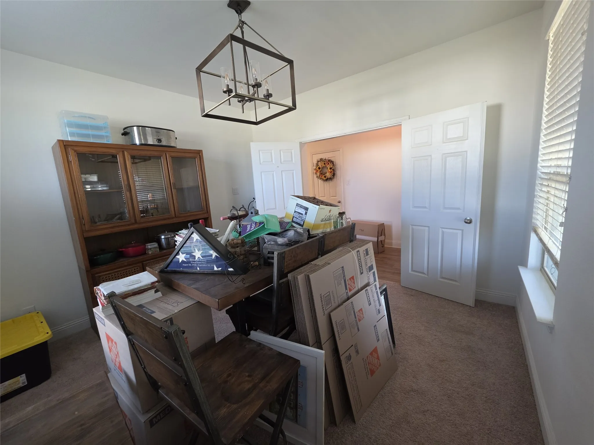 Recessed lighting, wood-finish flooring, and a contemporary ceiling fixture