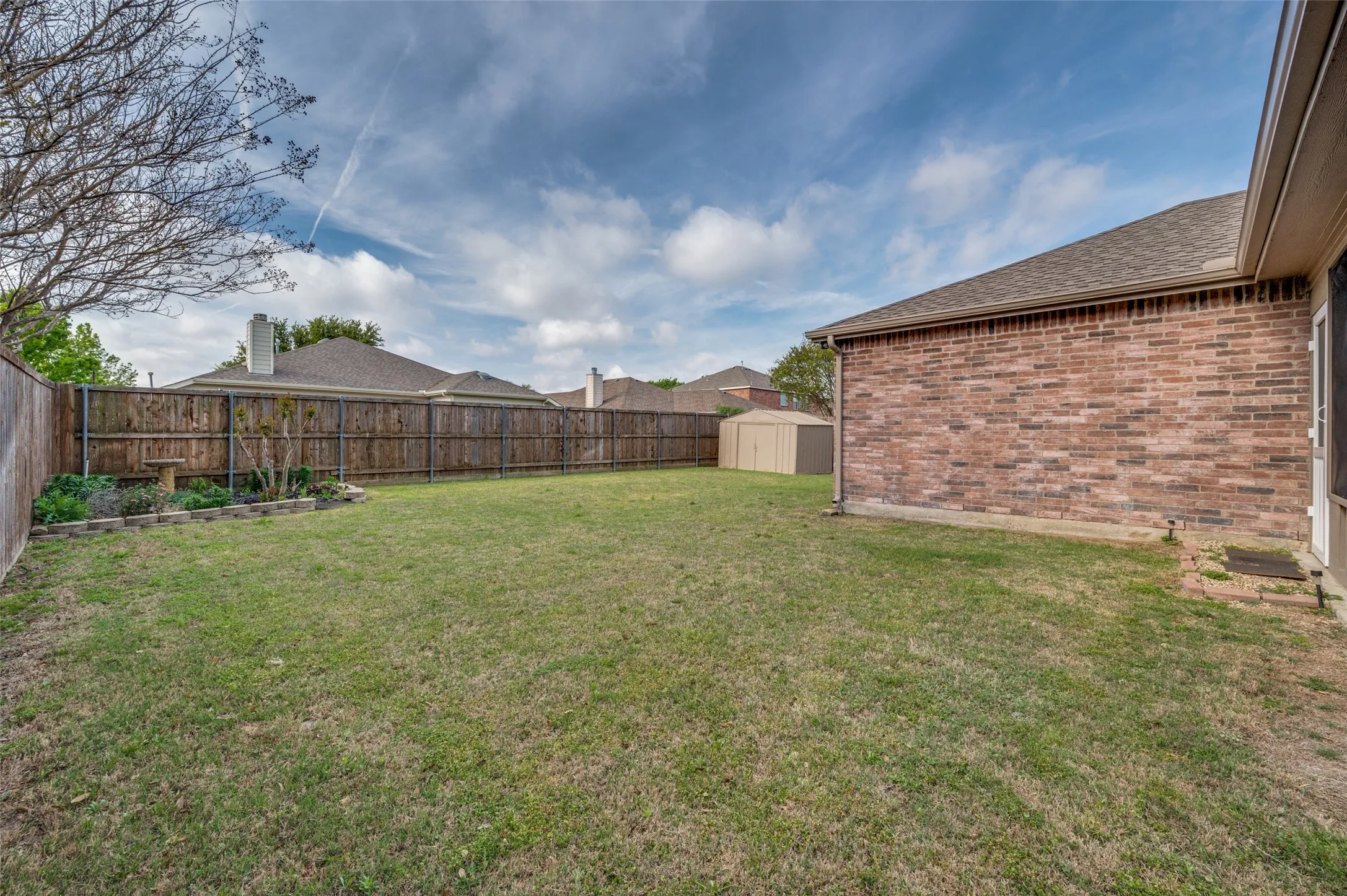 Corner garden, shed, and space for a pool.