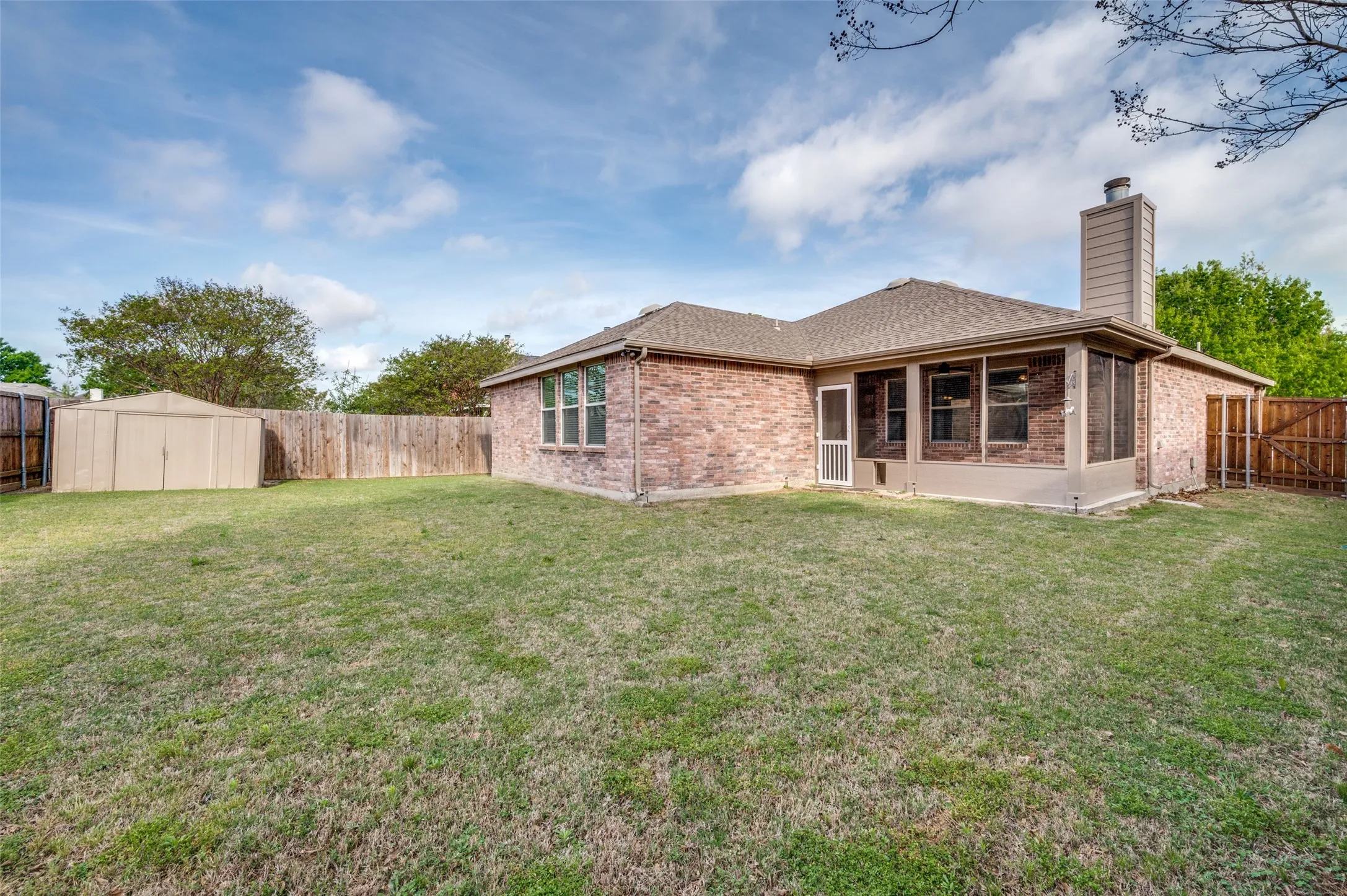 Large backyard showing newly built screened backporch.