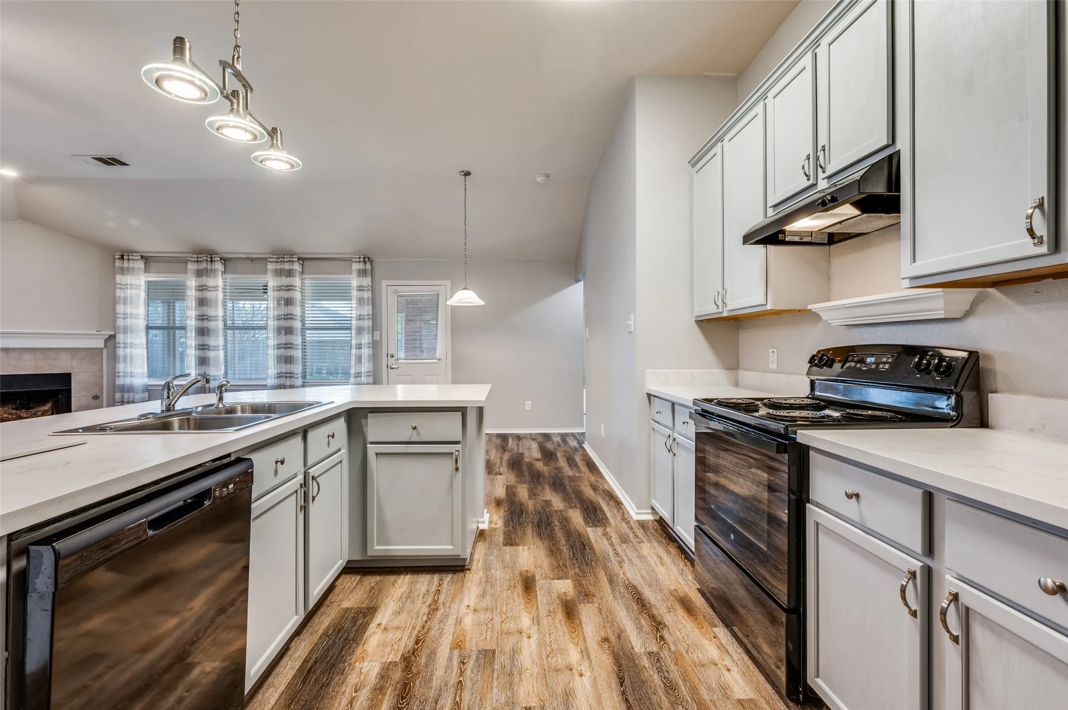 Eat-in kitchen with updated lighting.