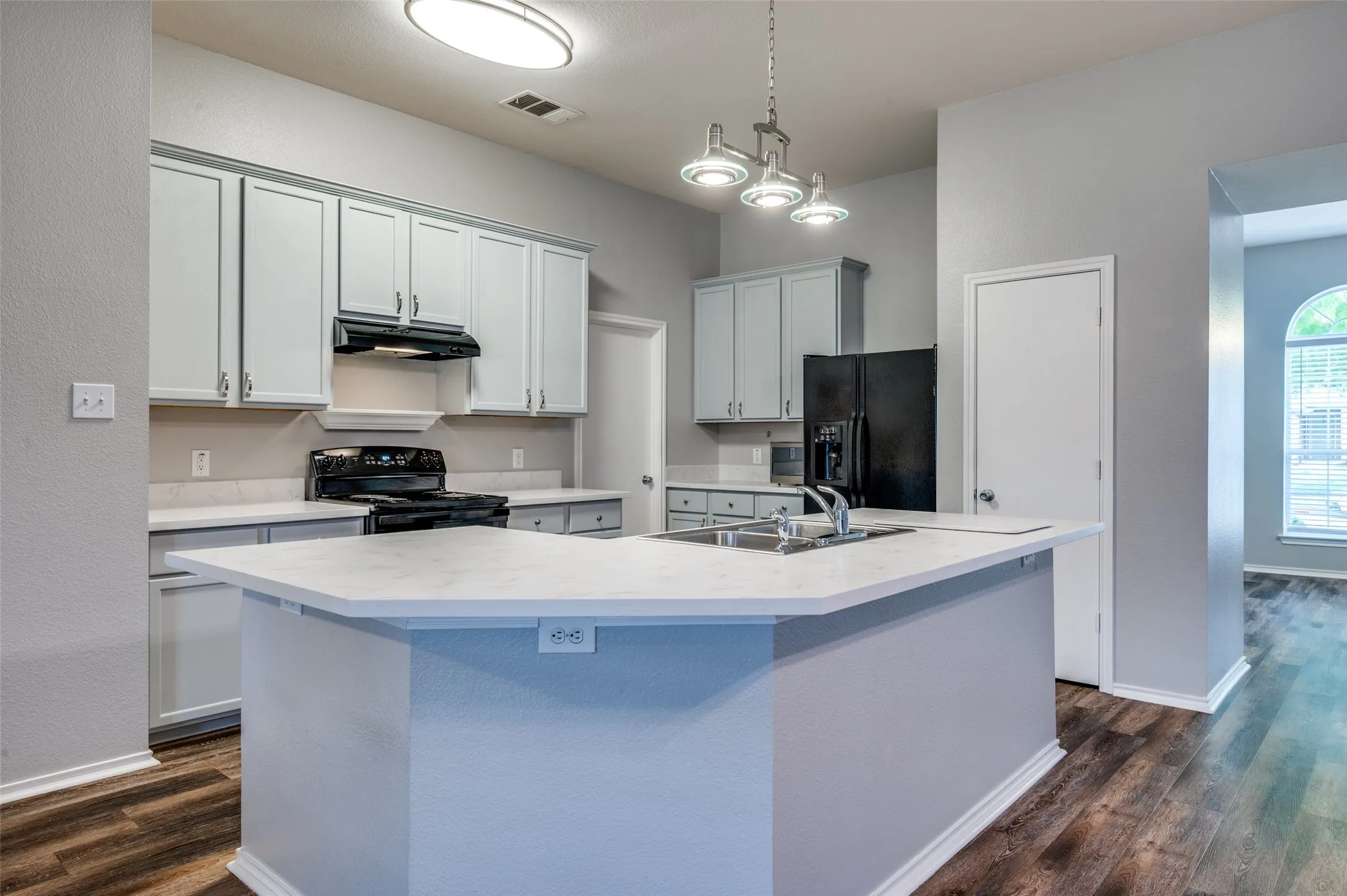 New lighting and bright eat-in kitchen bar.