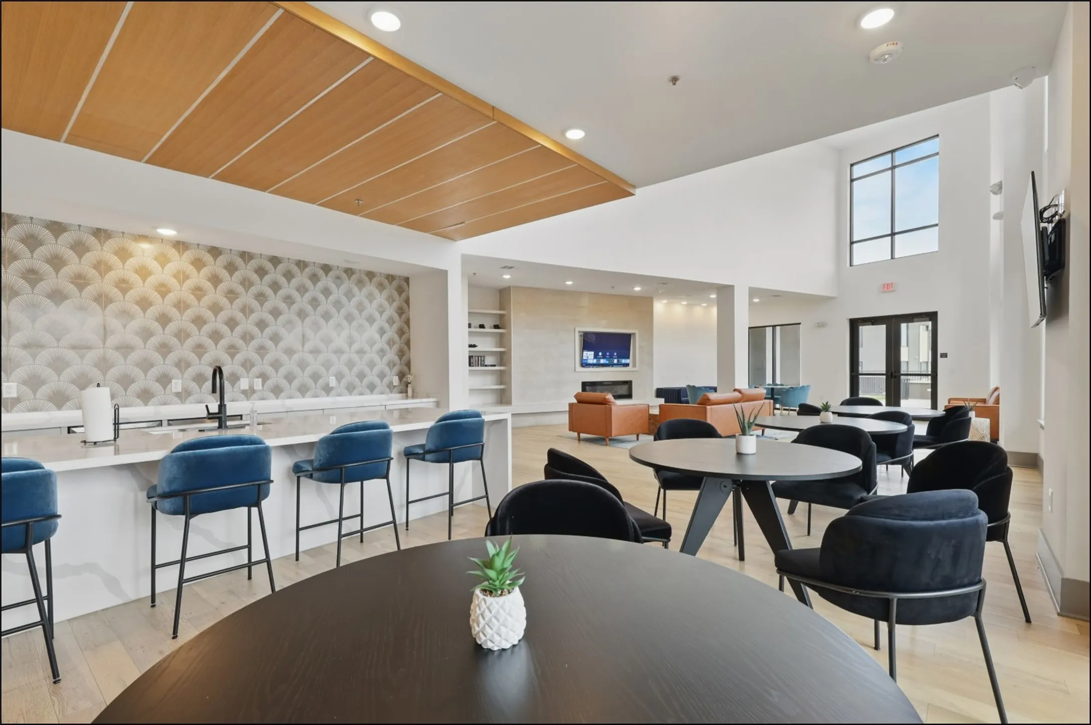 Vaulted ceilings, a built-in media center, and light wood-finish flooring