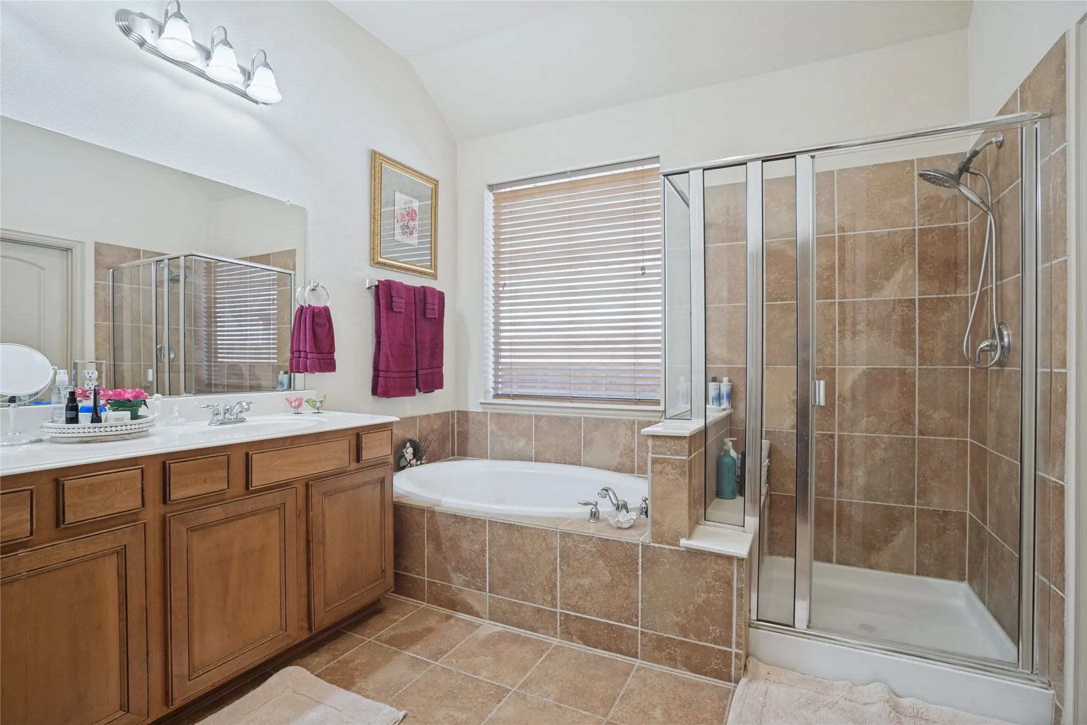 Enjoy your own private retreat in the spacious primary bathroom, featuring a relaxing garden tub, separate shower, and an oversized walk-in closet with plenty of room for wardrobe and storage needs.
