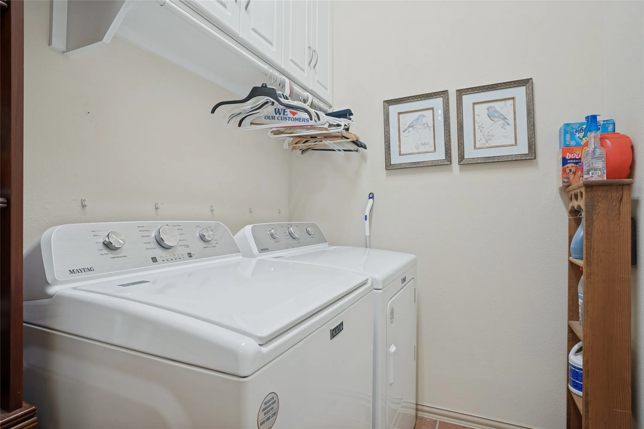 Oversized utility room with plenty of shelving and storage.