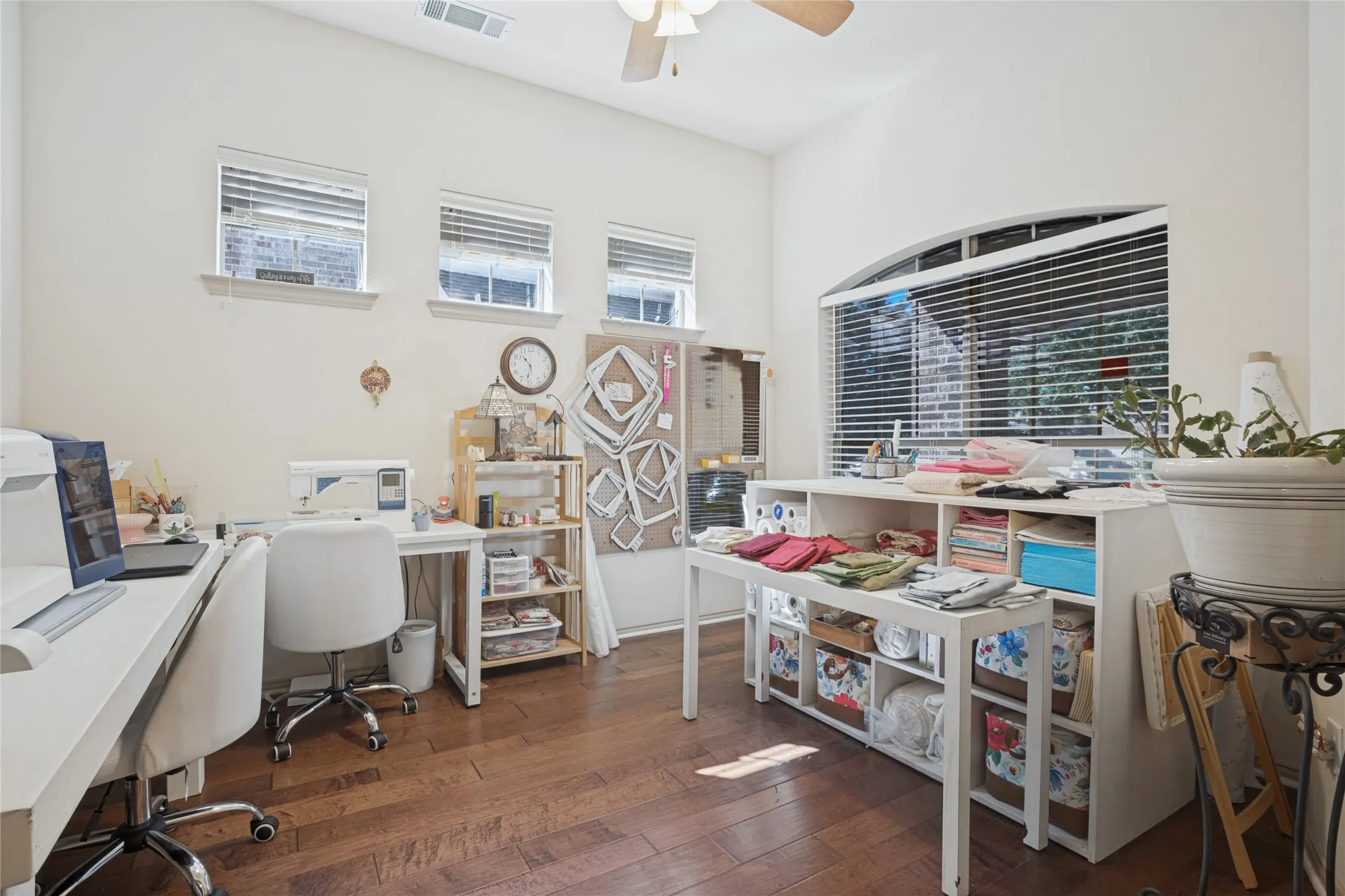 A versatile front-facing office offers a quiet, dedicated space for working from home, pursuing hobbies, or creating a space tailored to your needs. Currently used as a sewing room, this flexible space offers endless possibilities.
