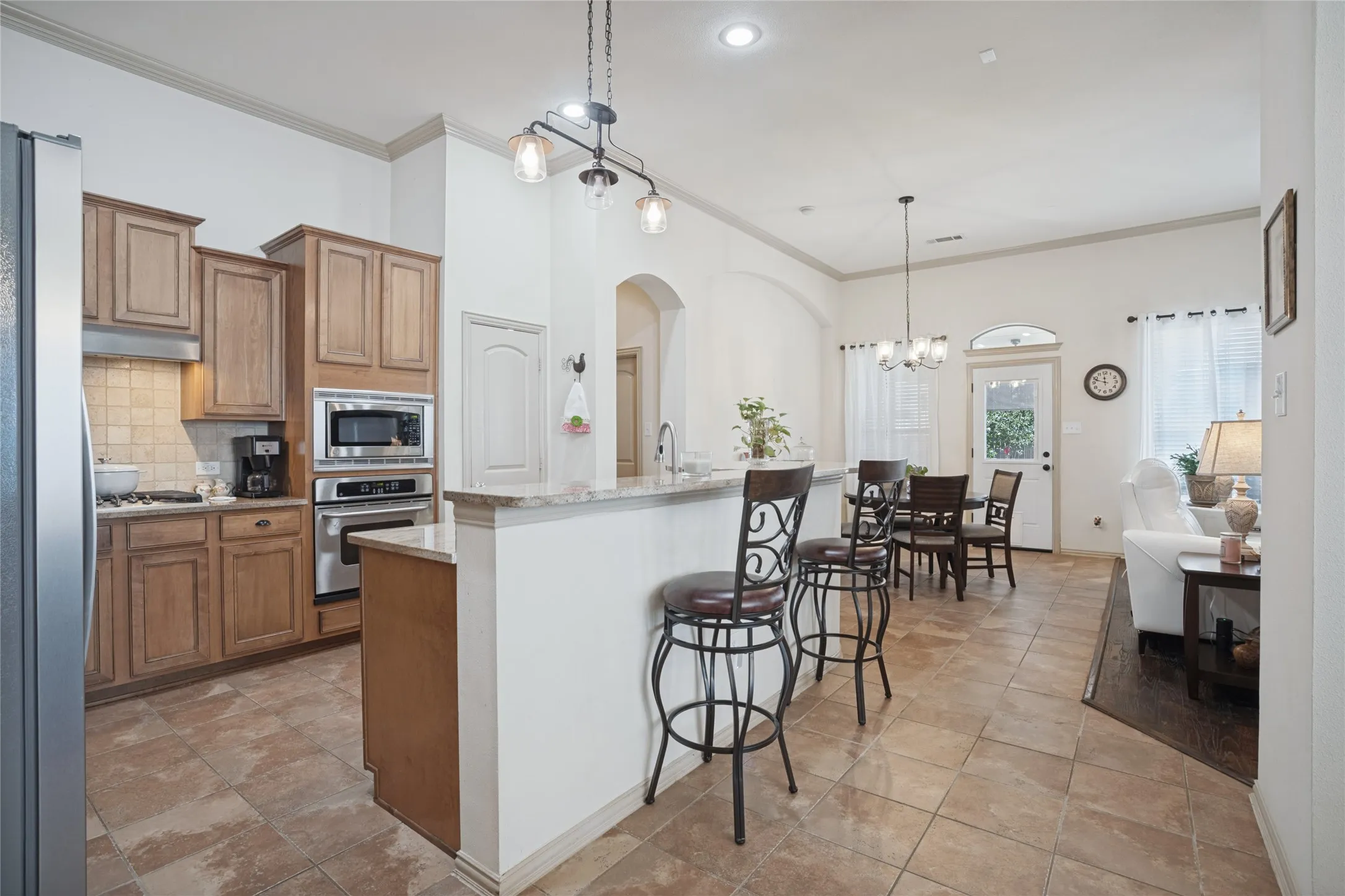 The heart of the home! The open-concept kitchen flows seamlessly into the living area, creating the perfect space for family gatherings, entertaining friends, and making memories together.

