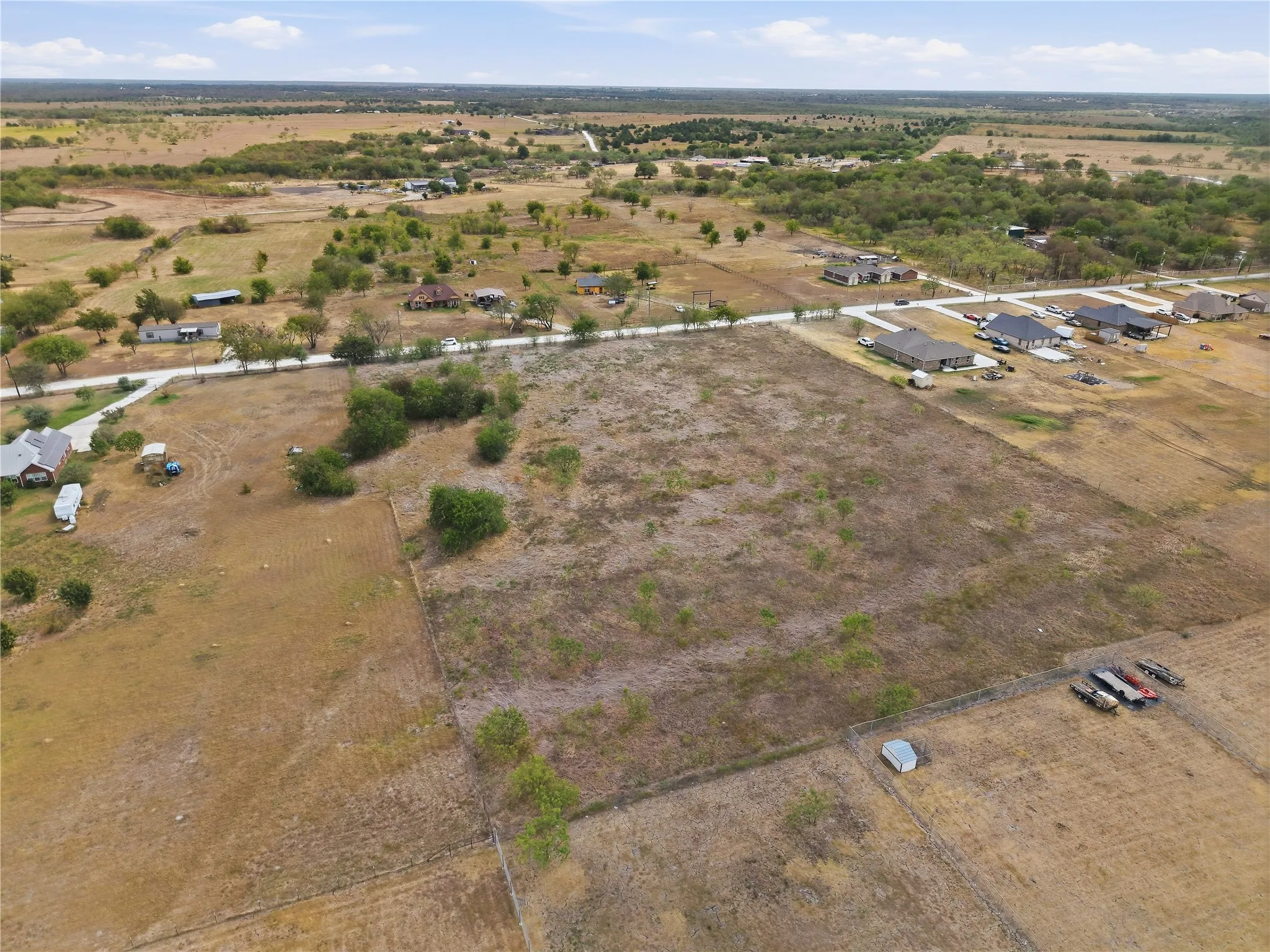 Expansive undeveloped land featuring natural terrain and sparse vegetation