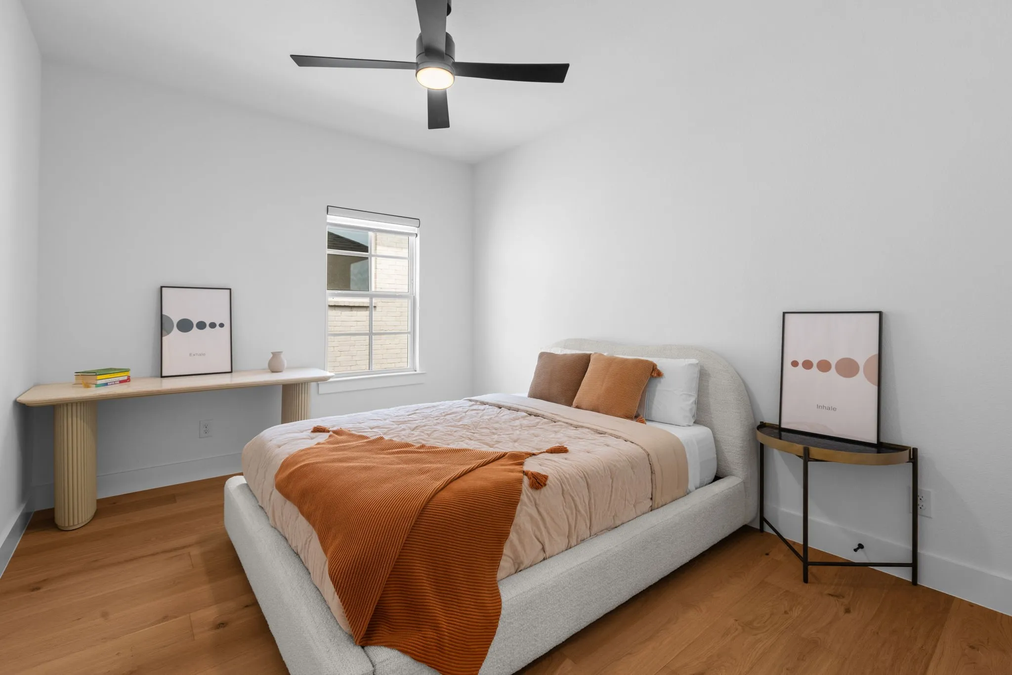 Hardwood flooring, contemporary ceiling fan, white walls, and a window with blinds