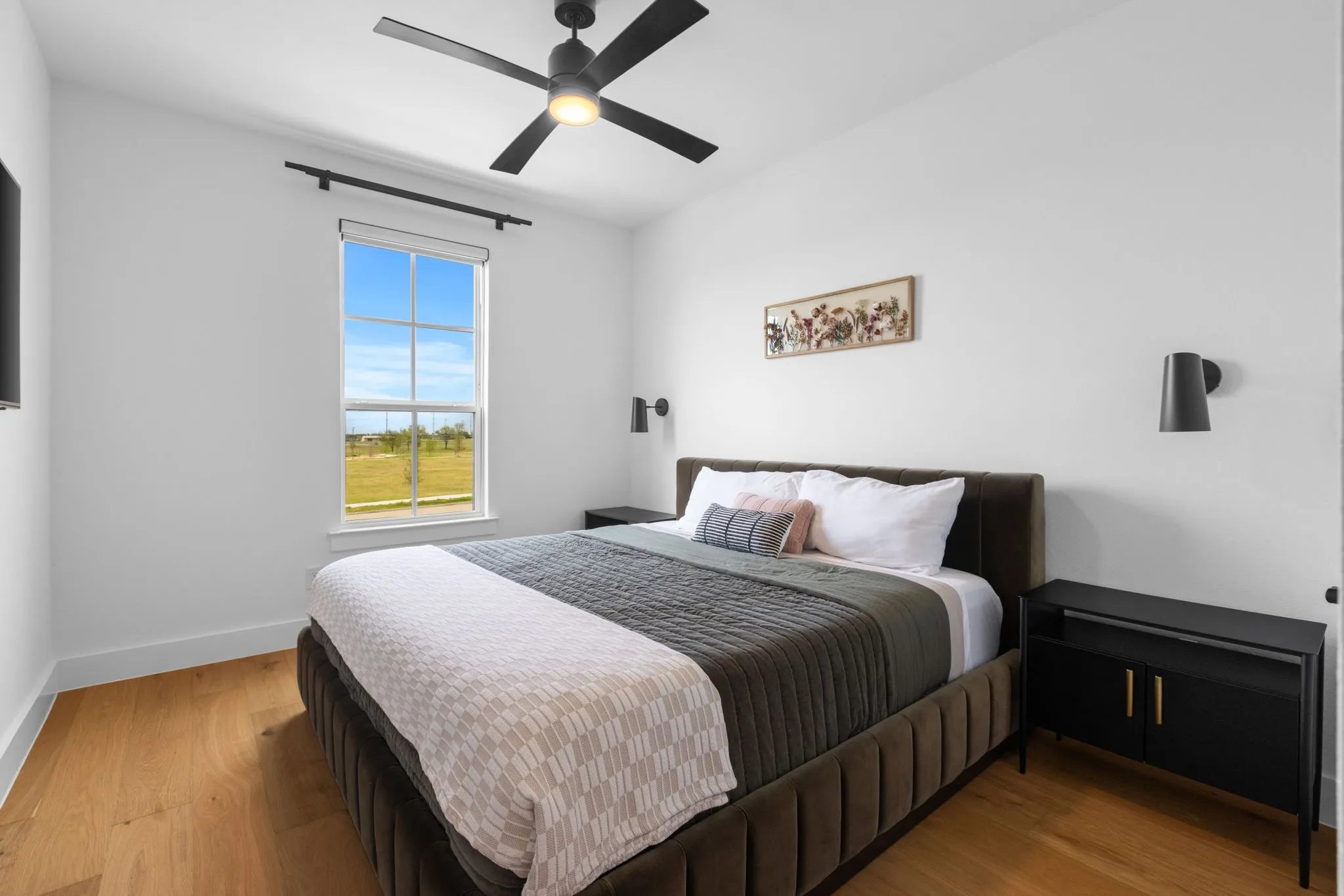Hardwood-finish flooring, recessed lighting, and a ceiling fan with integrated light