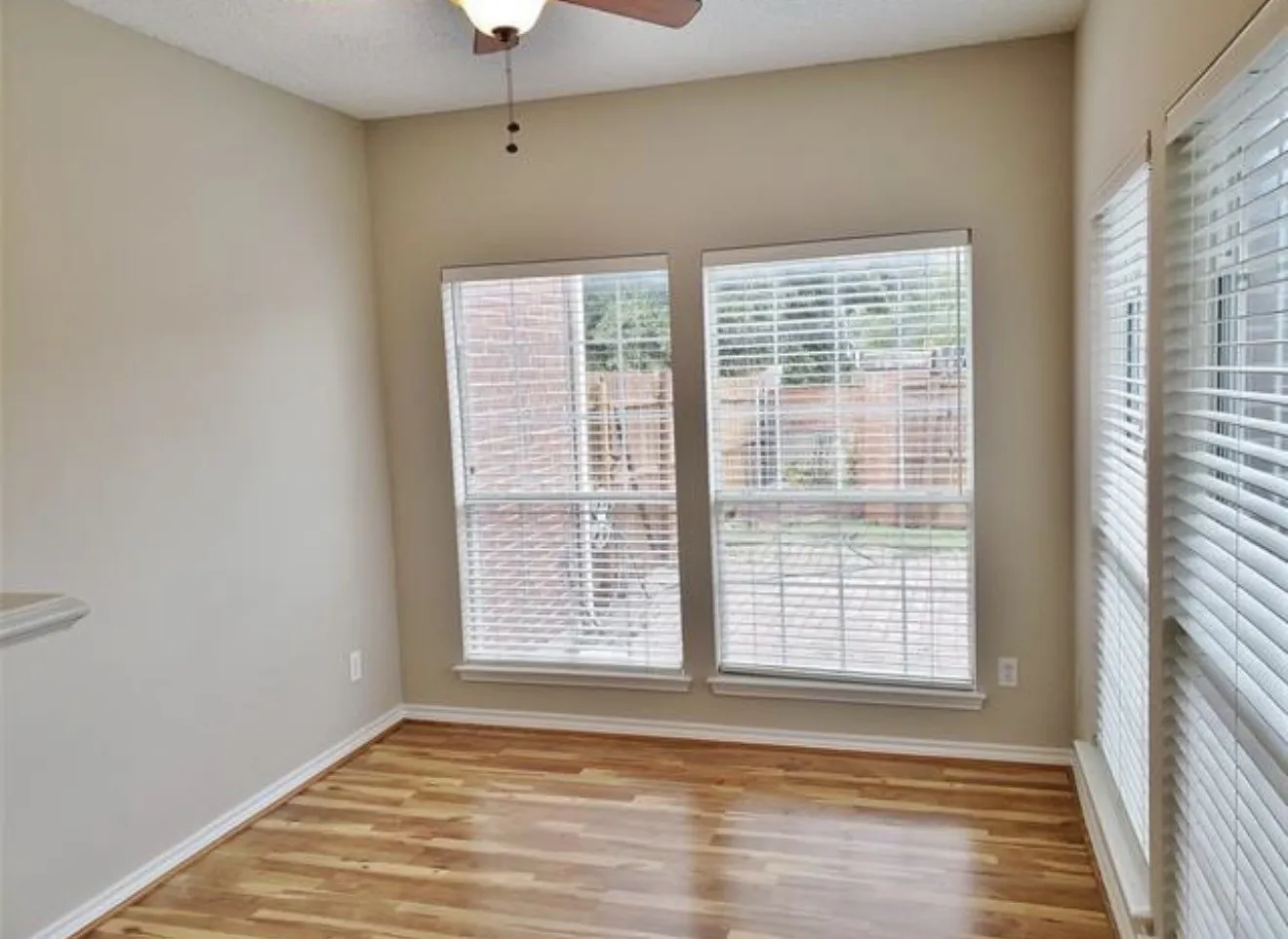 Wood-finish flooring with white trim