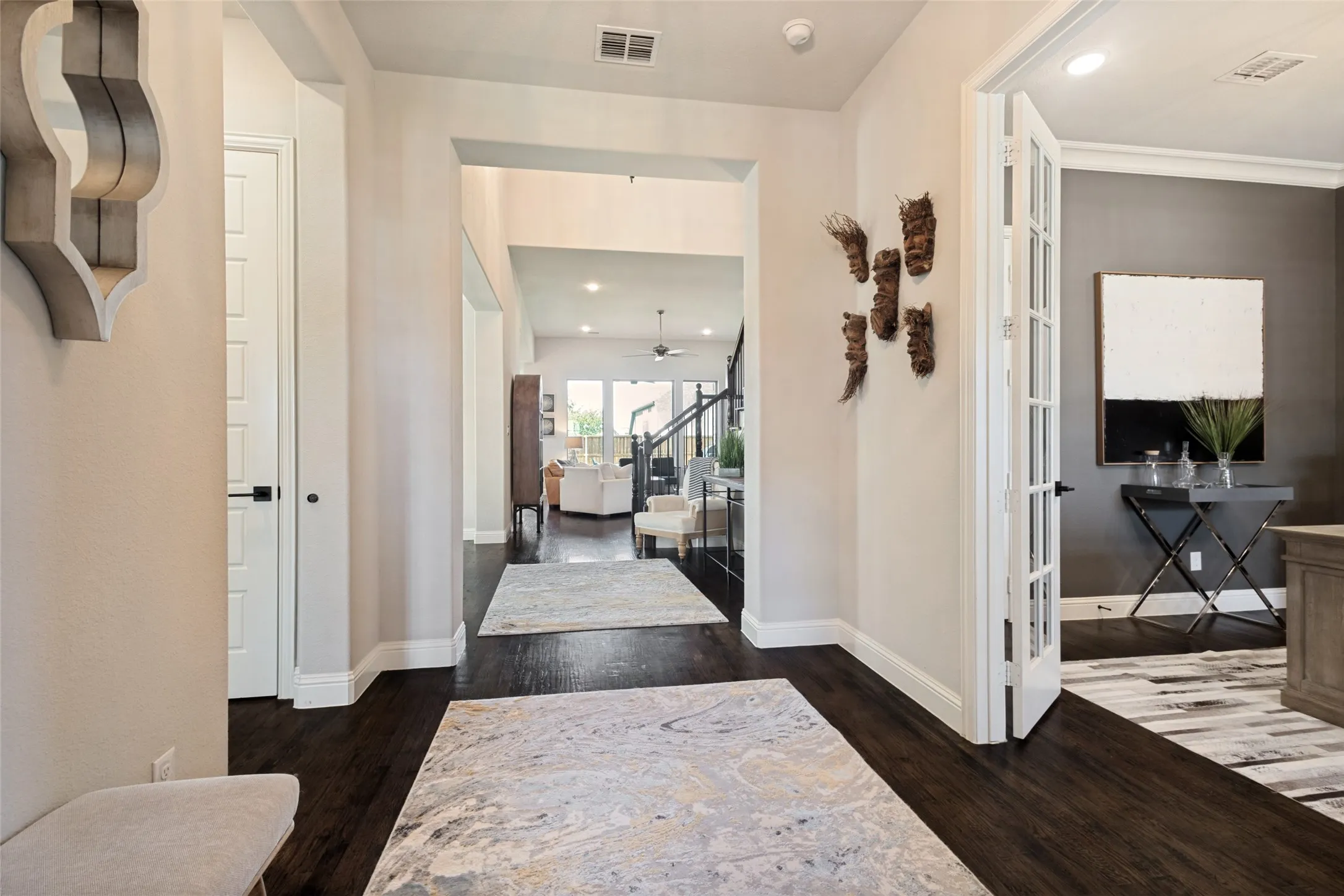 Double Foyer with hand-scraped solid wood floors, 8' solid-core doors and wide-open spaces