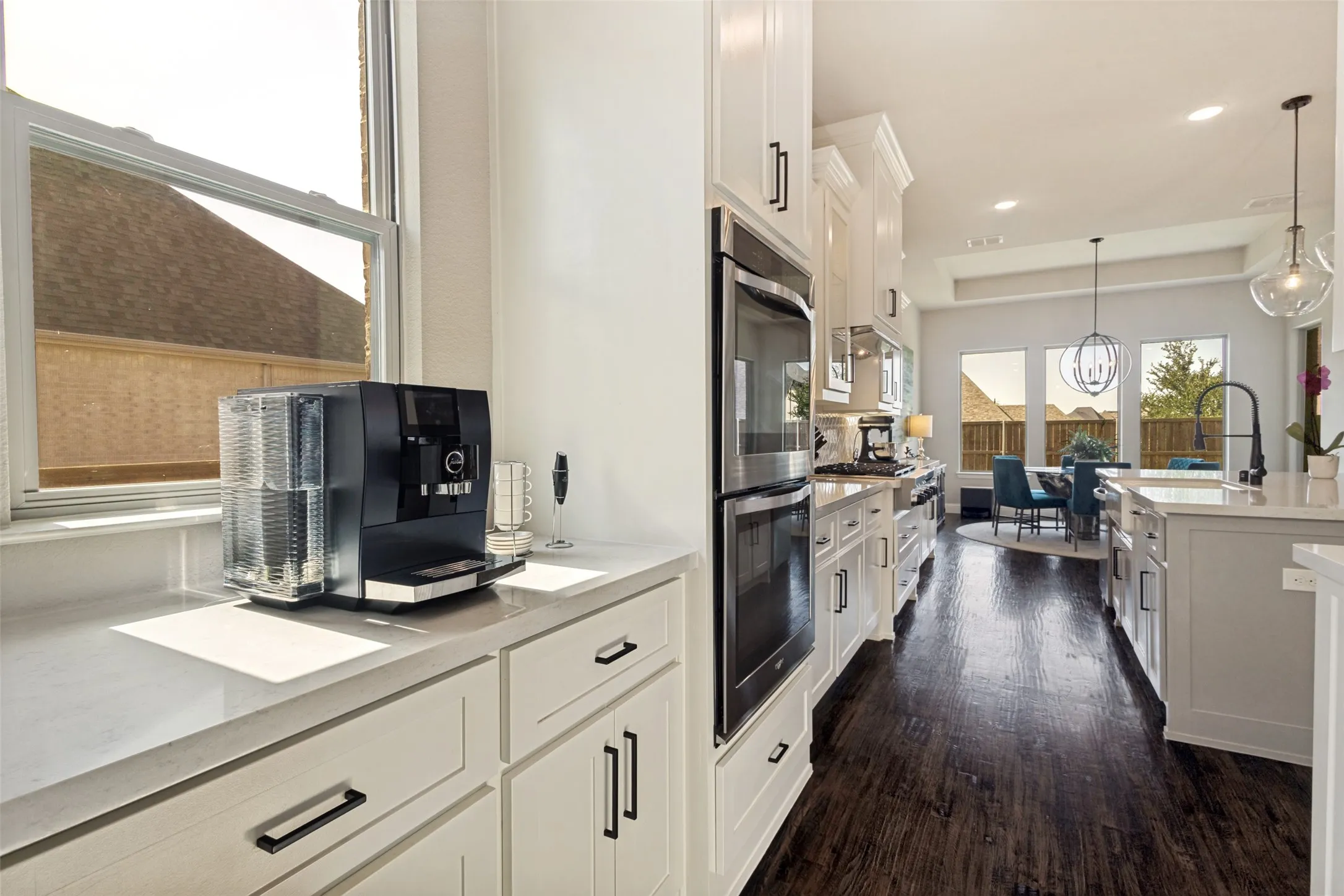 Butler's pantry for extra storage or coffee bar and built-in double ovens