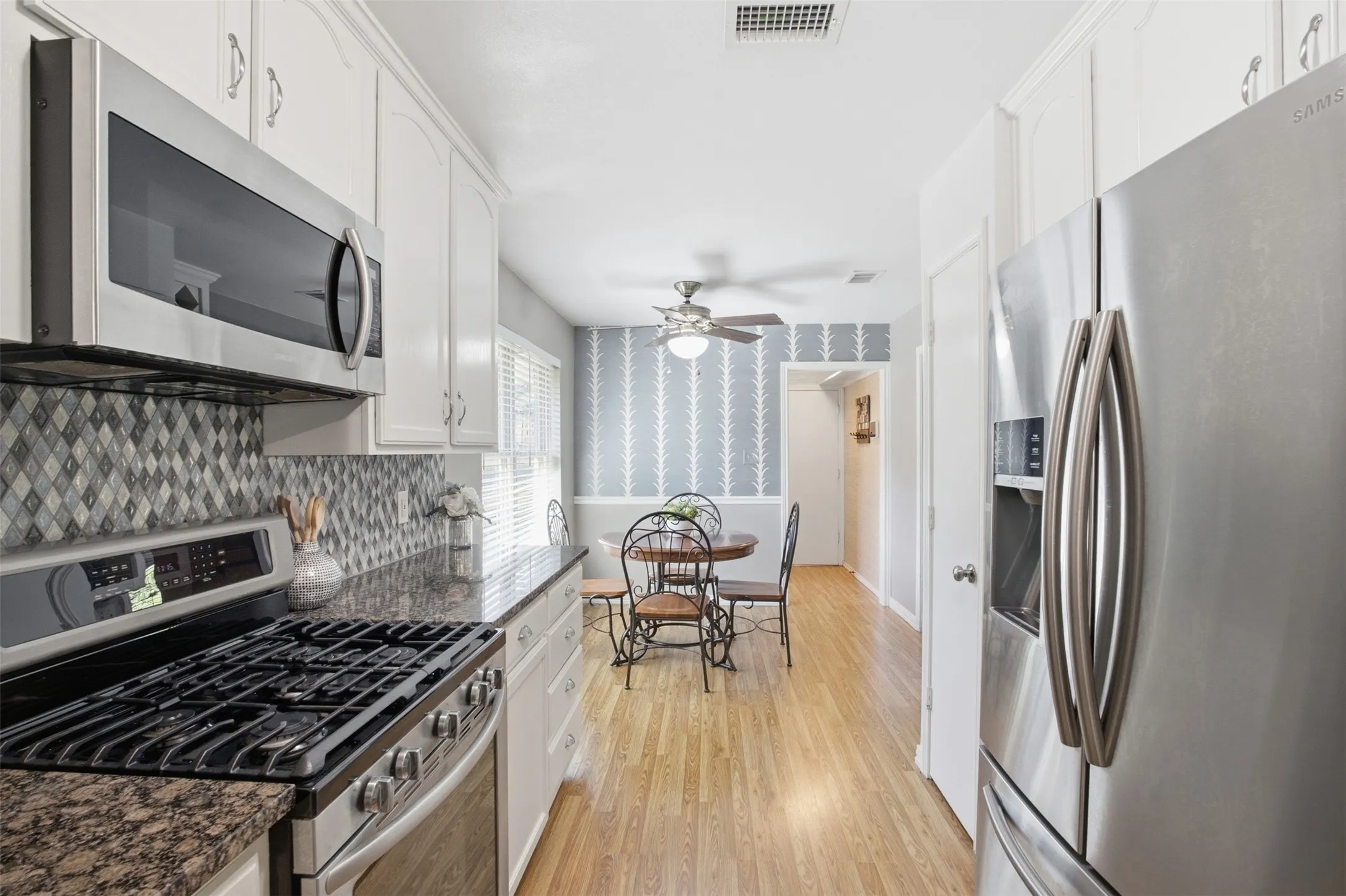 Another view of the kitchen, thoughtfully arranged for everyday cooking and entertaining.