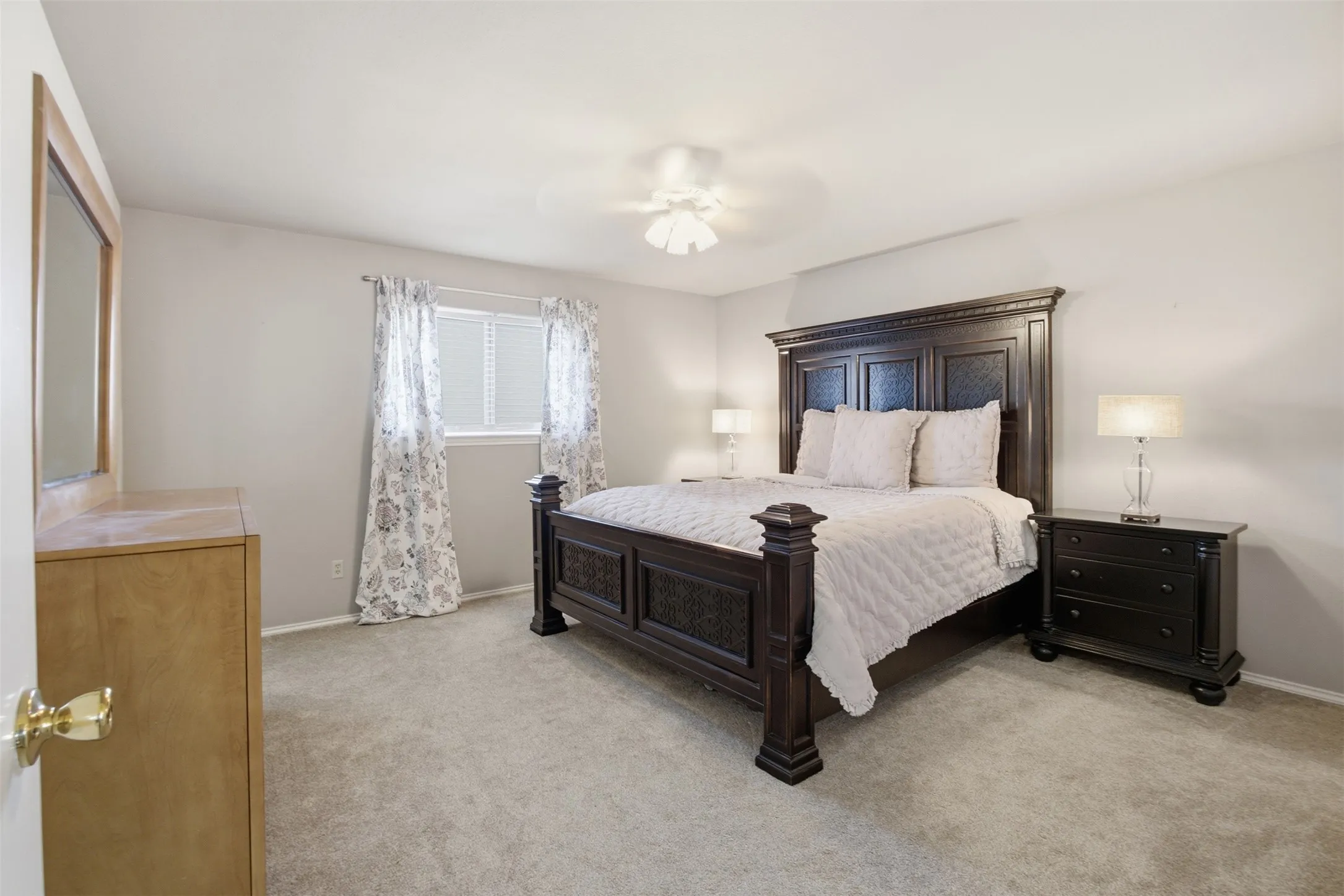 A spacious primary retreat with room to relax and recharge at the end of the day.