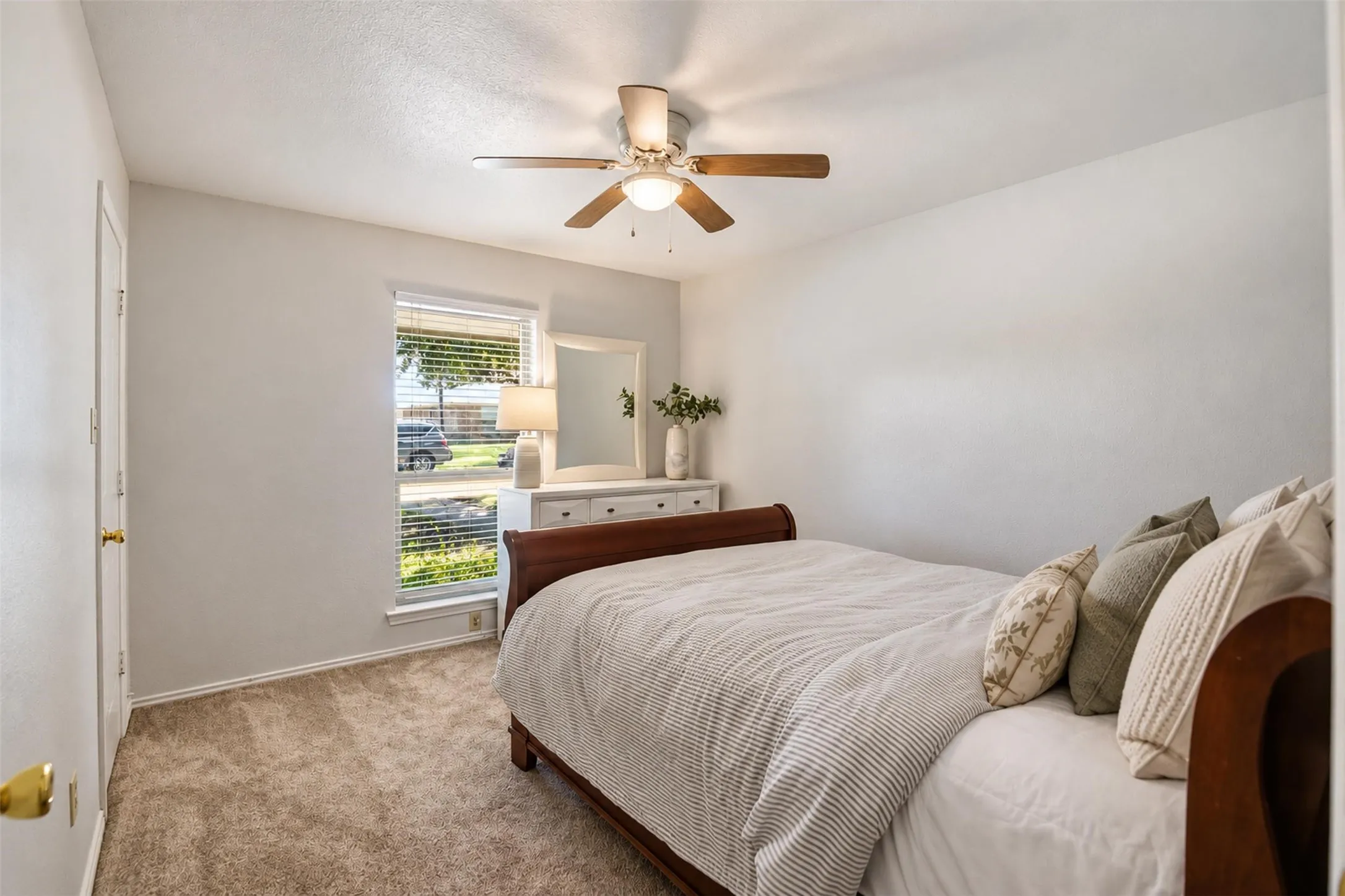 A comfortable secondary bedroom complete with its own walk-in closet.
