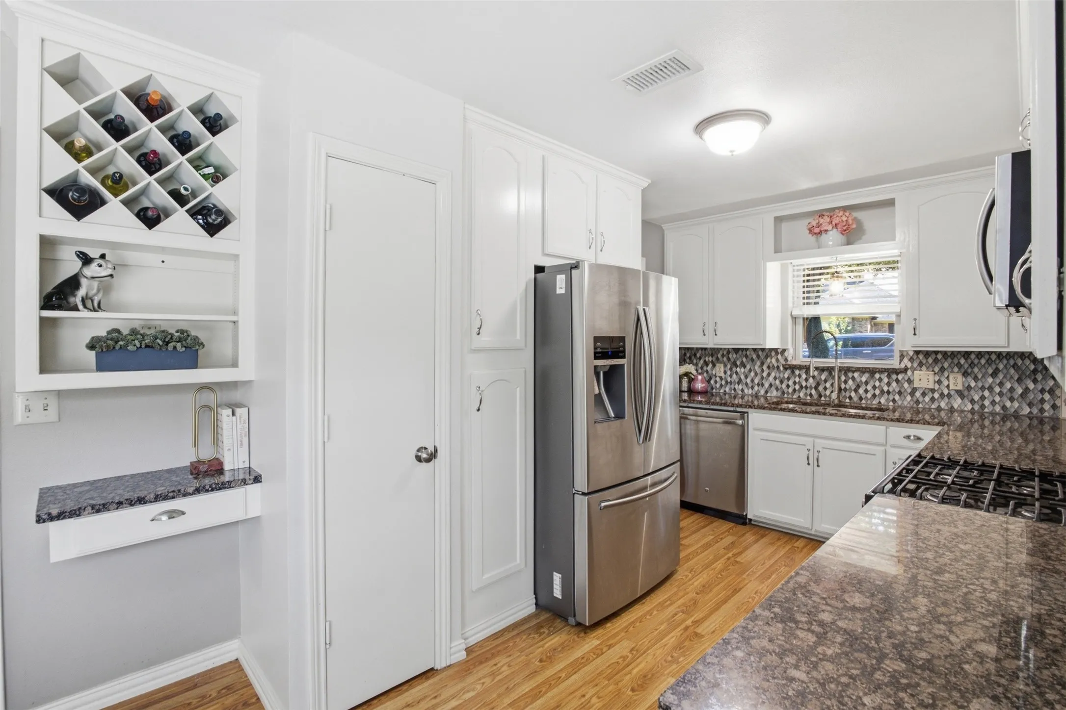 Plenty of cabinetry and countertop space make this kitchen as practical as it is inviting.