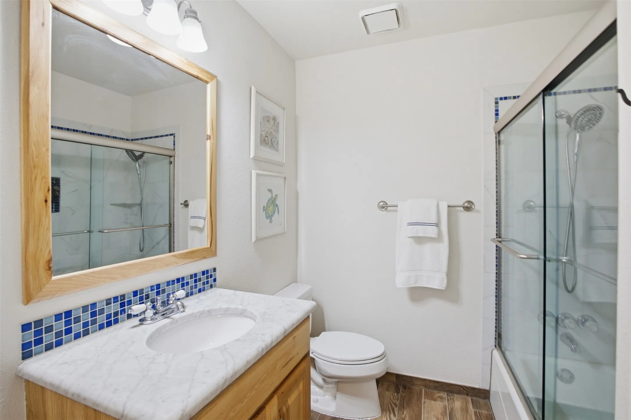 Secondary bathroom featuring a tub and shower combination.