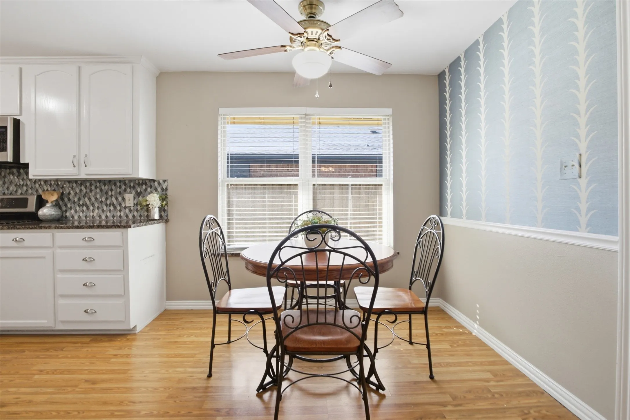 A charming dining nook just off the kitchen, perfect for morning coffee or gathering around the table.