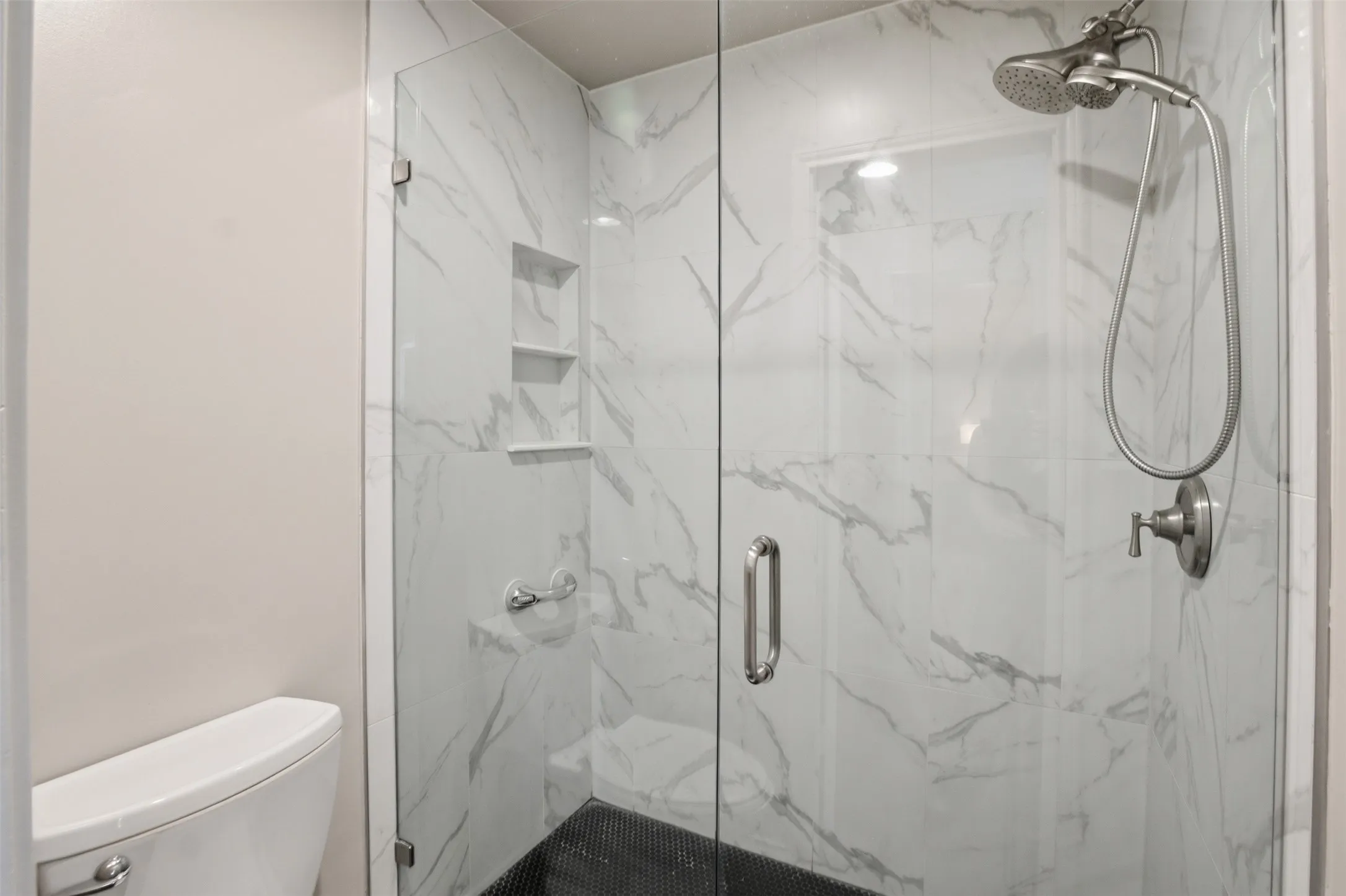 A closer look at the primary bath's shower and updated finishes.