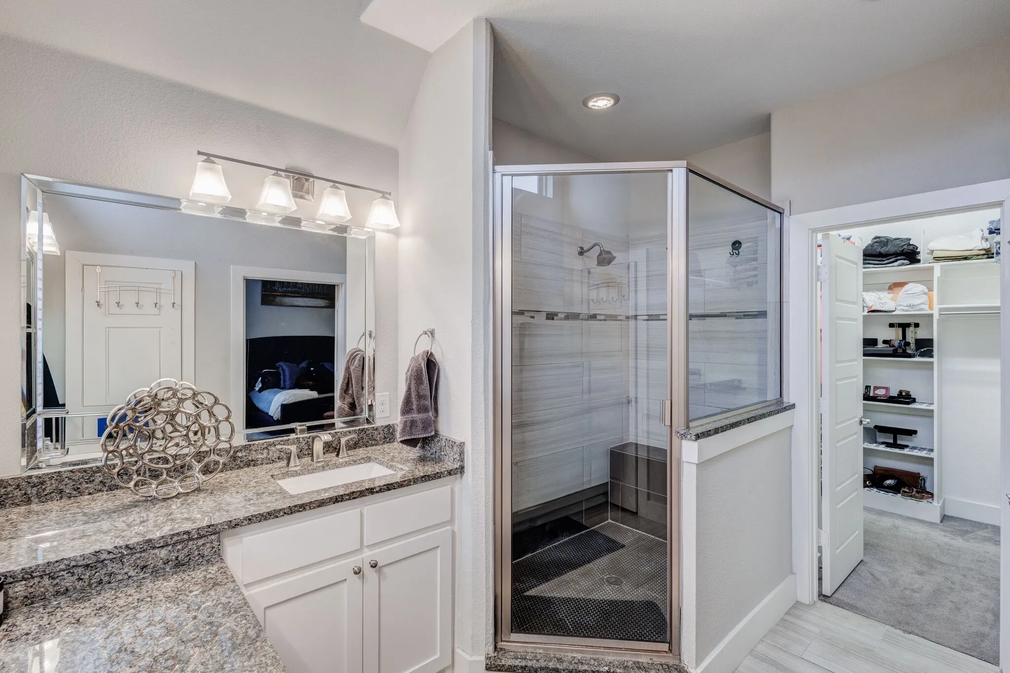 Dual vanity with stone countertop and undermount sink