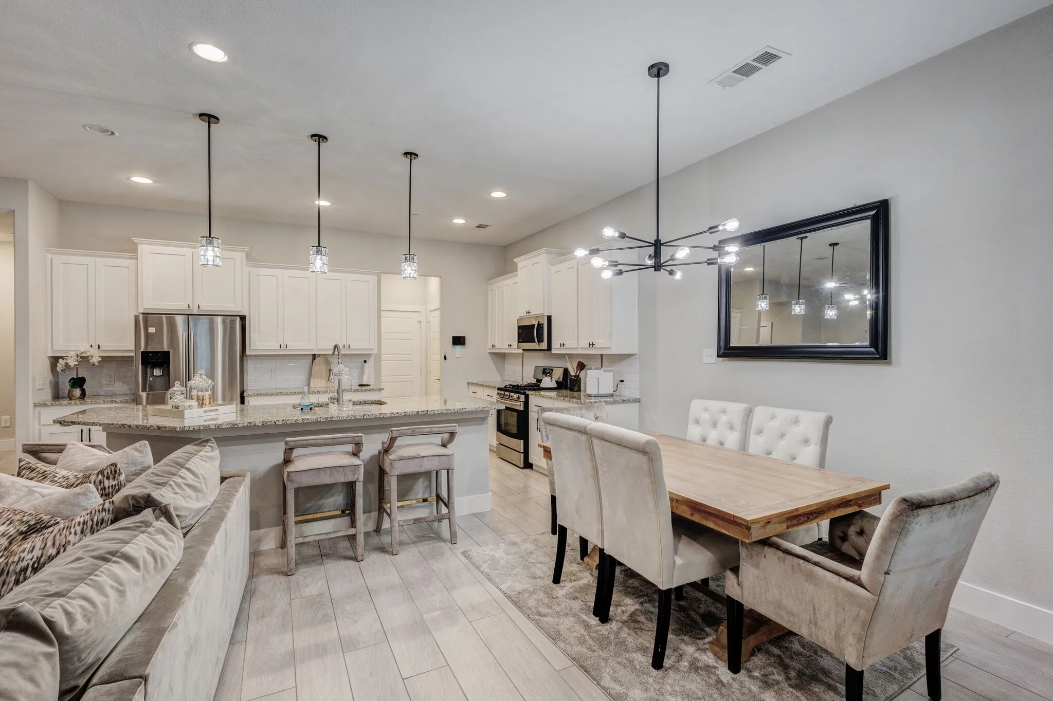 Kitchen island with granite countertop and pendant lighting