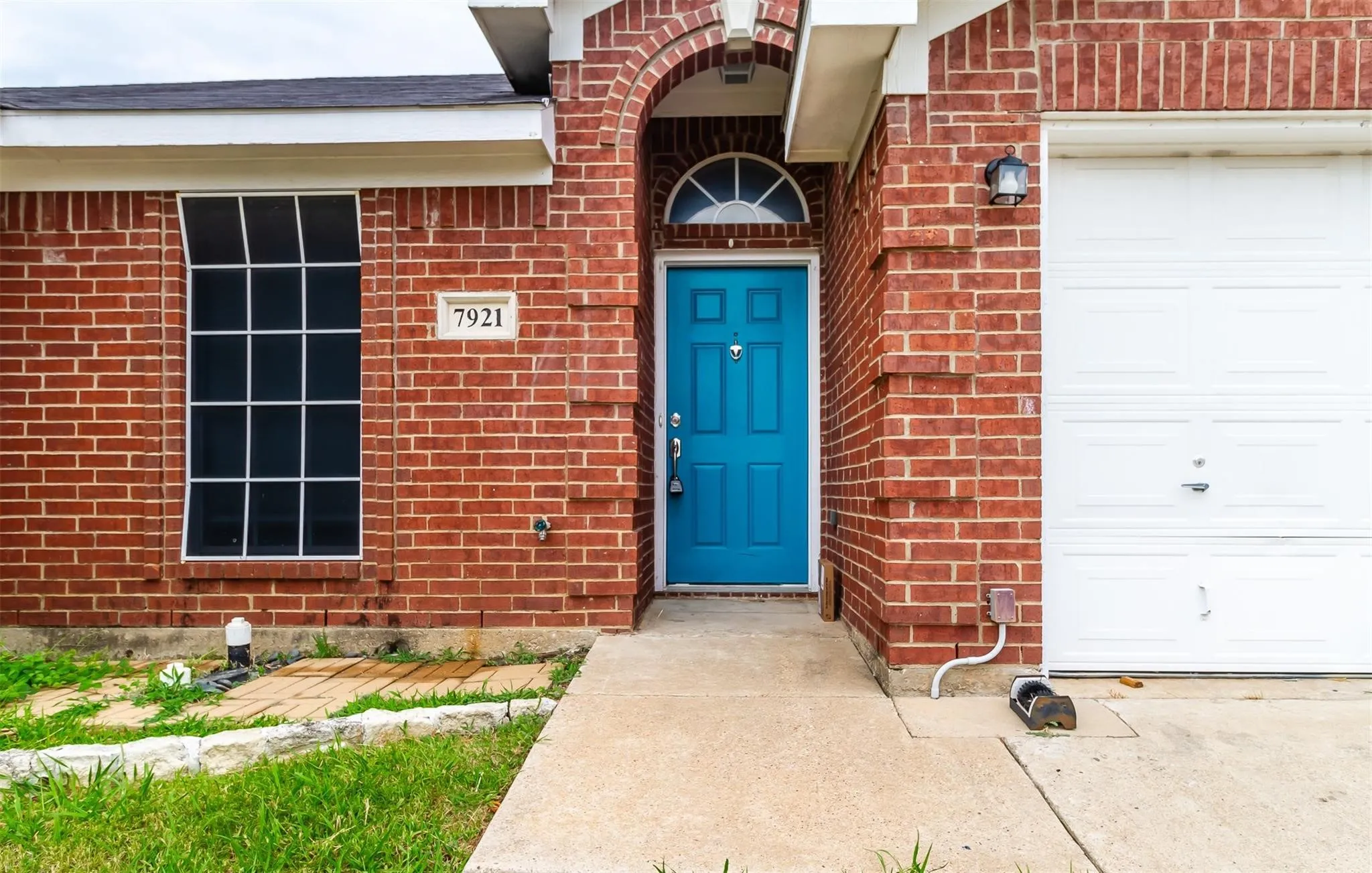 Red brick exterior with white trim