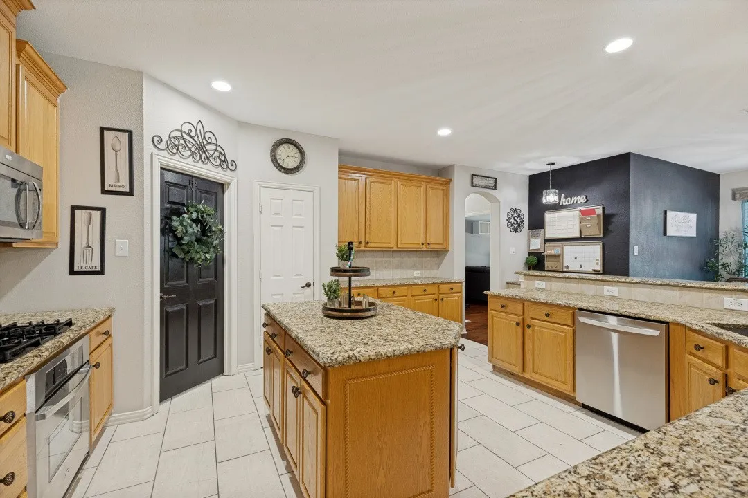 Dining room with a charming chalkboard accent wall and a built-in desk/home command center for added functionality.