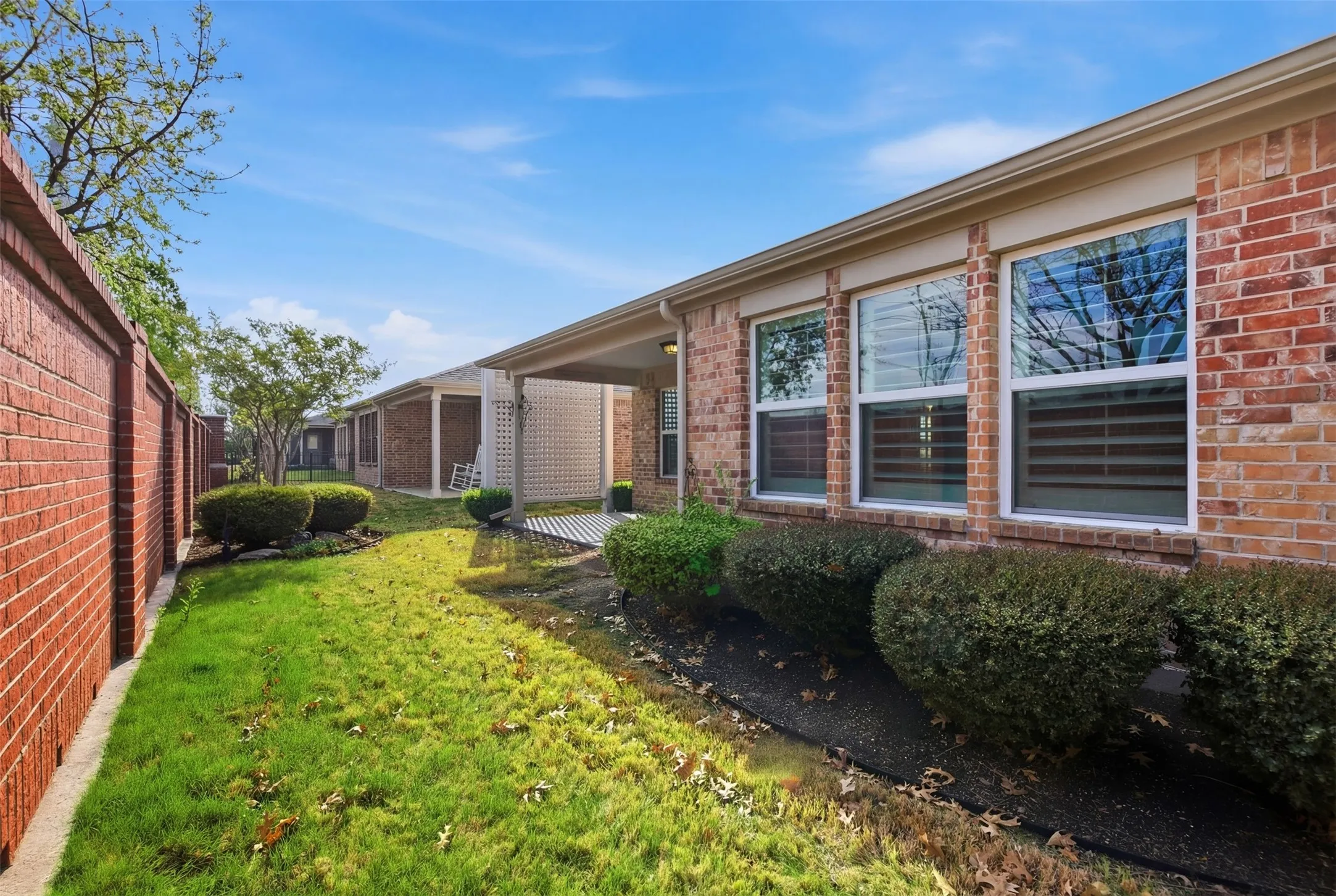 Brick exterior with multiple windows and white trim