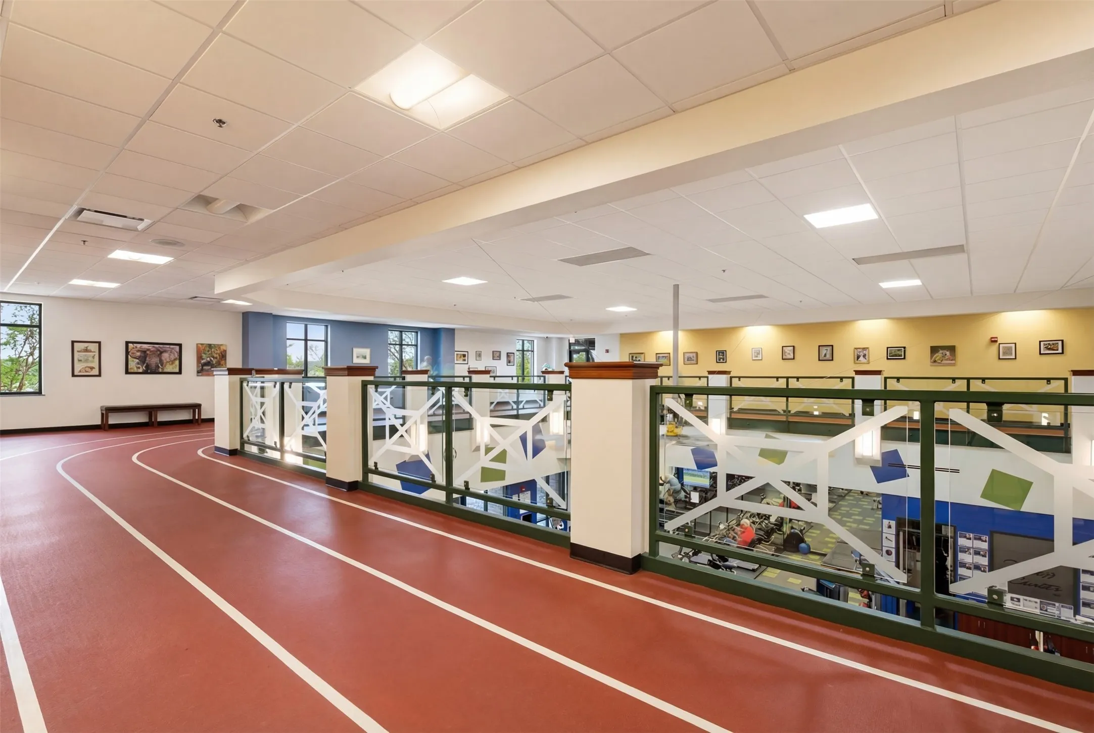 Indoor running track with red surface and white lane markings
