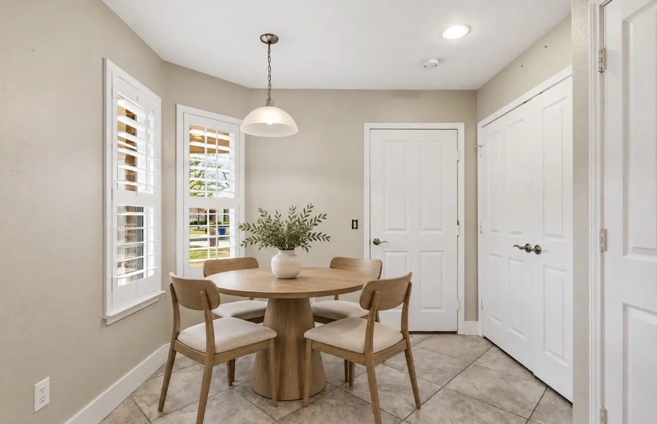 Plantation shutters, tiled flooring, recessed ceiling lighting, and a pendant light fixture