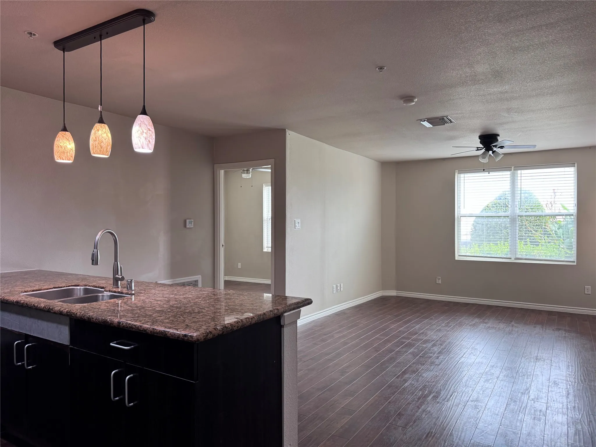 Kitchen island with a double basin sink and a pull-down faucet