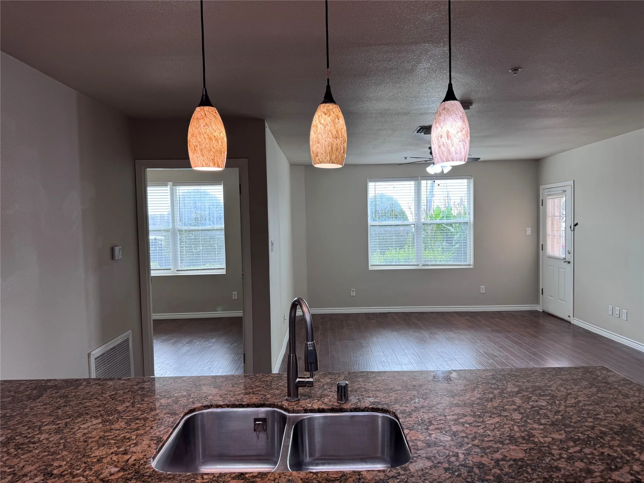 Kitchen sink with a dual basin and a gooseneck faucet
