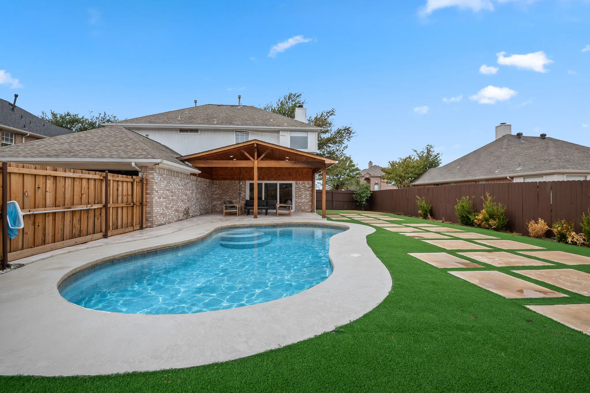 Photo edited to add water to pool. Not currently filled.