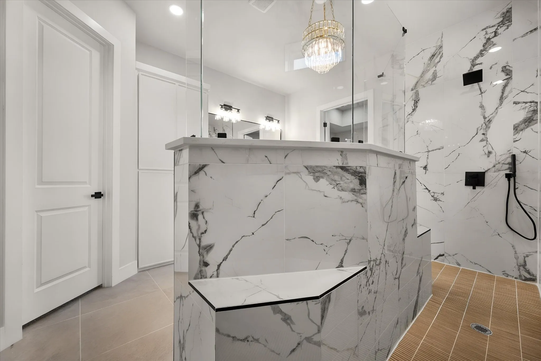 Walk-in shower with full height tile, integrated seating, glass enclosure, and wood-finish flooring