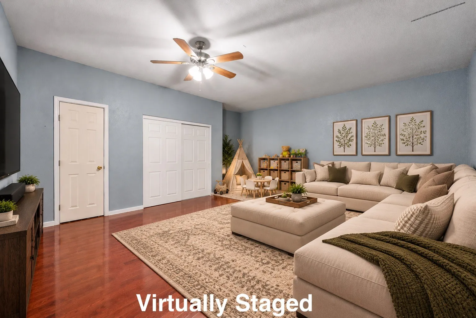 Vaulted ceiling, wood-finish flooring, white paneled interior doors, white paneled bi-fold closet doors, and a ceiling fan with light fixture