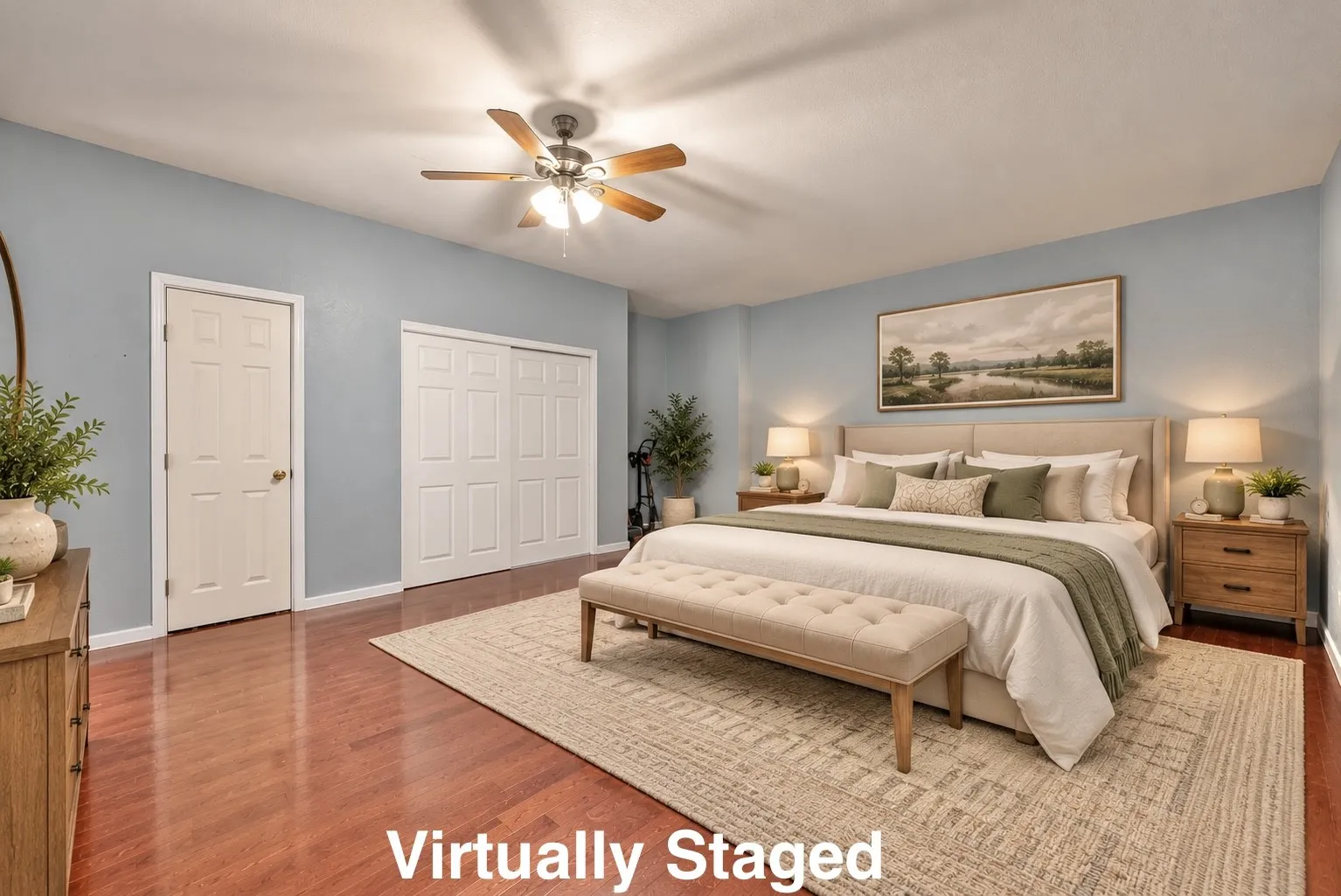 Wood-finish flooring, light blue wall paint, white trim, recessed lighting, and a ceiling fan with light fixture