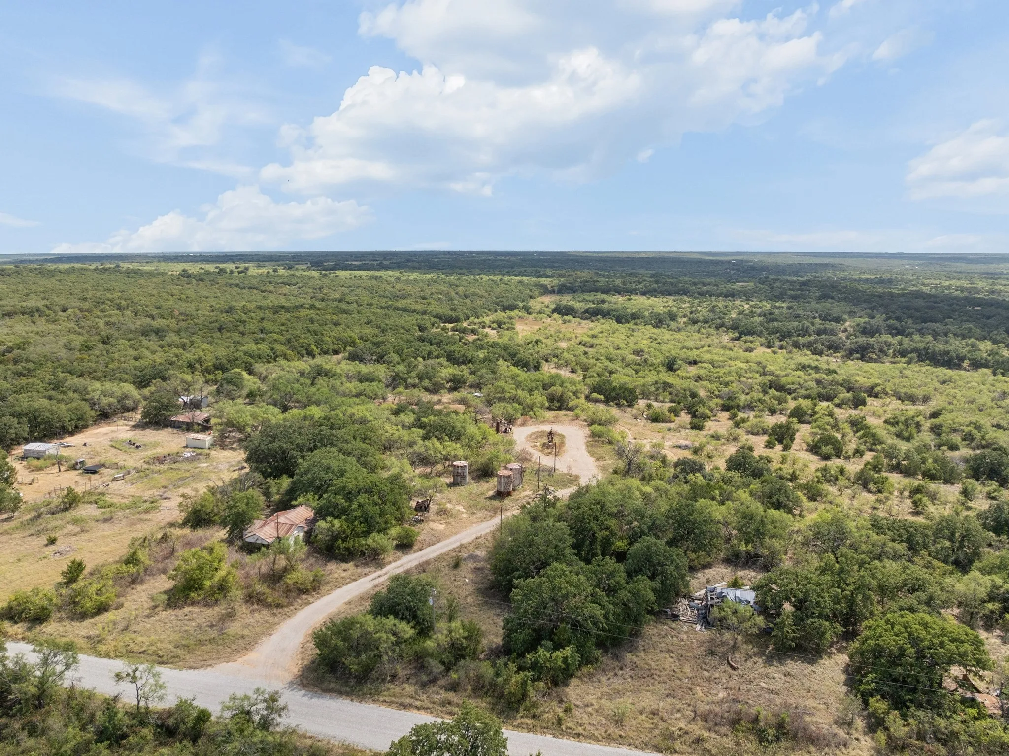 Expansive acreage featuring abundant mature trees and natural landscaping