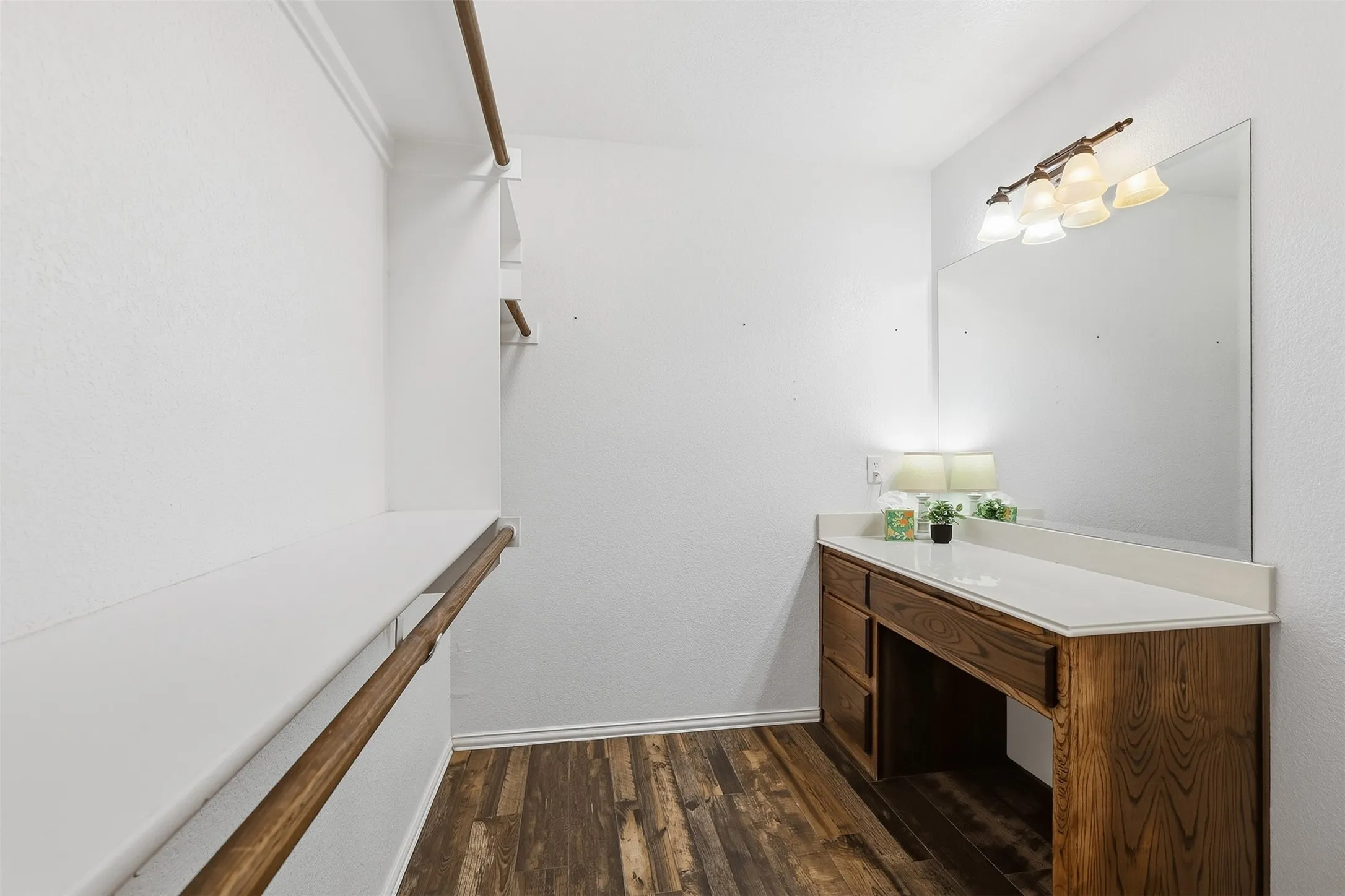 Wood-finish flooring with white baseboards
