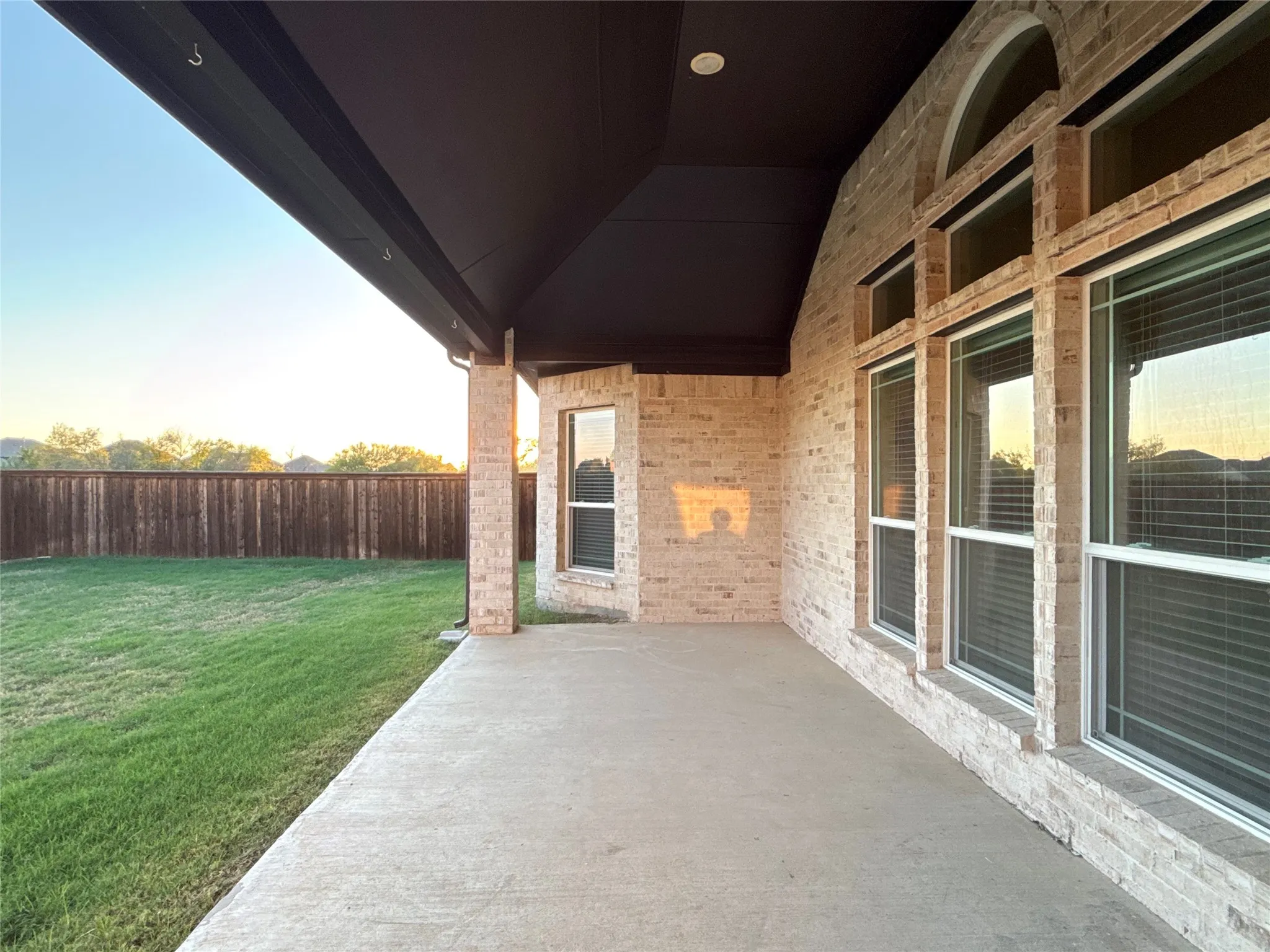 Covered patio with a concrete surface