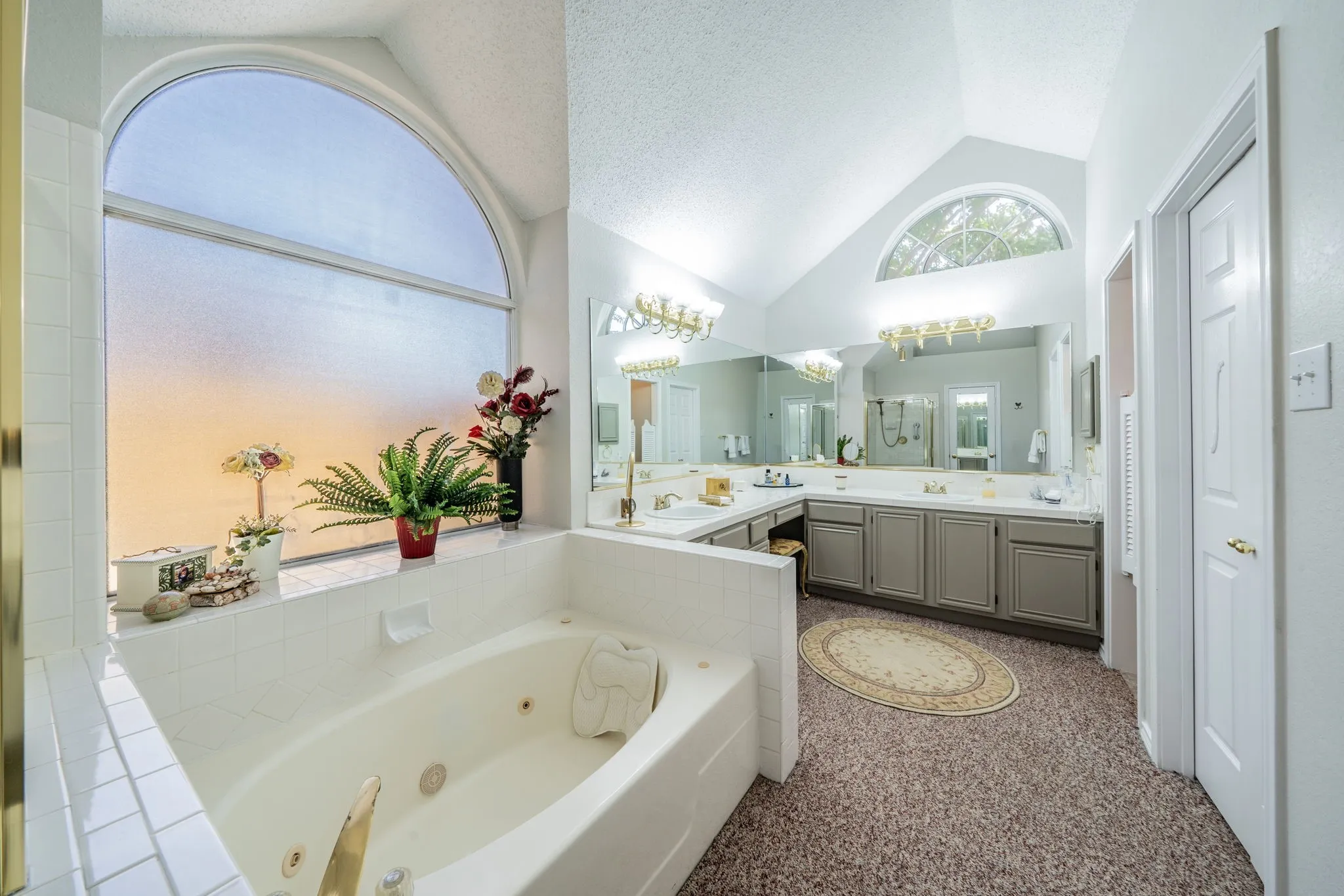 jetted Soaking tub with white tile surround