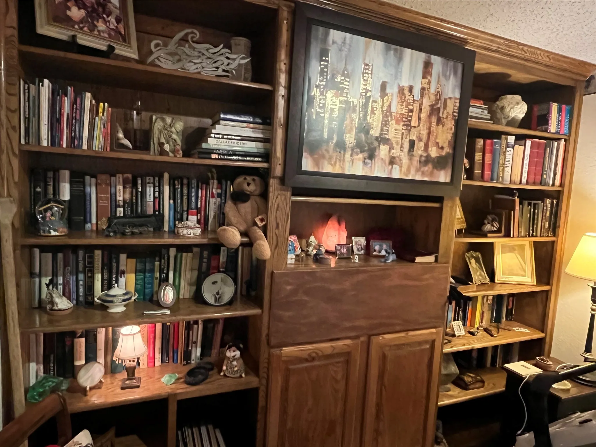 Built-in custom oak integrated cabinetry w bookcases for your library and collectables