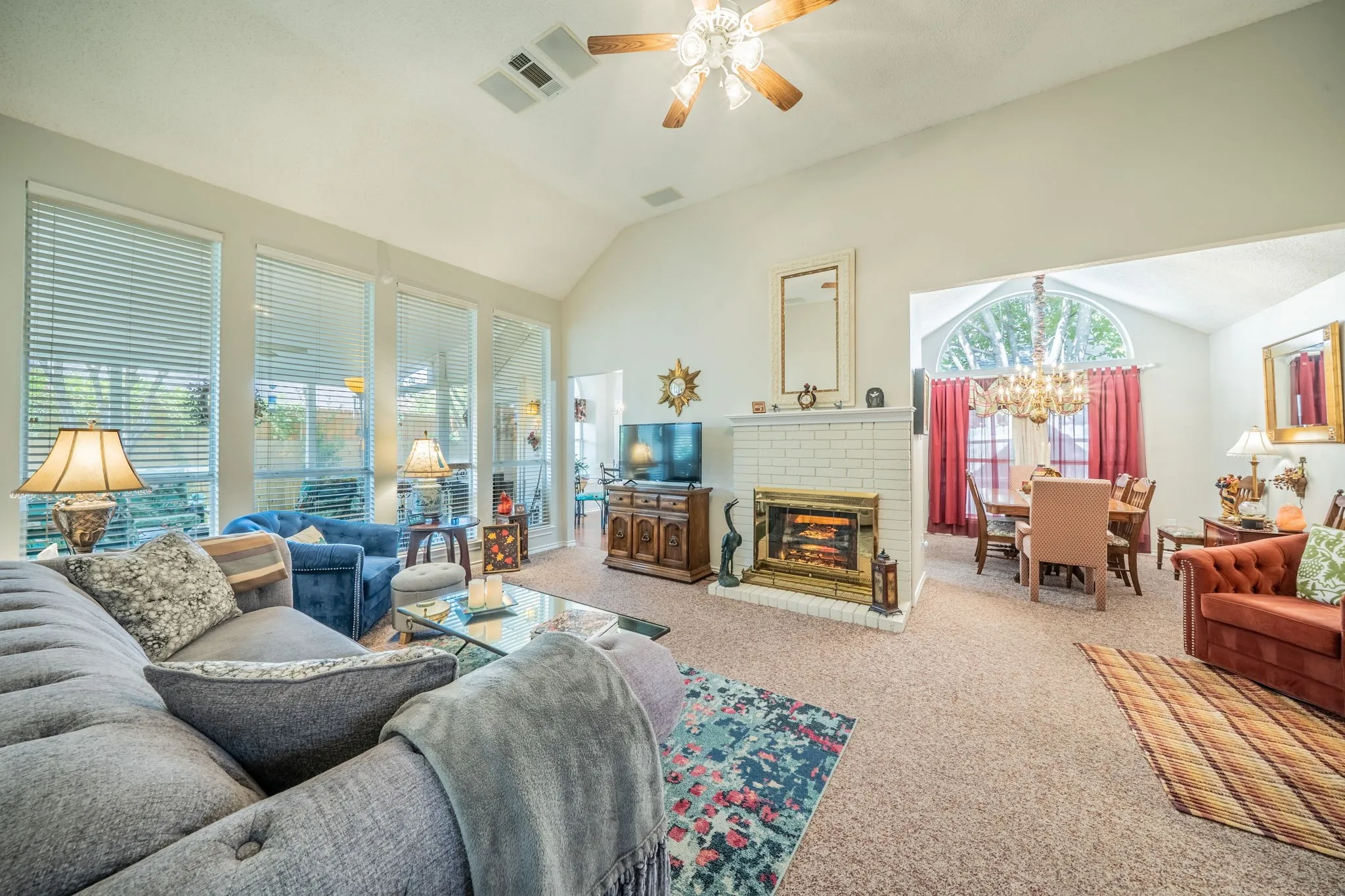 Vaulted ceiling with ceiling fan fireplace