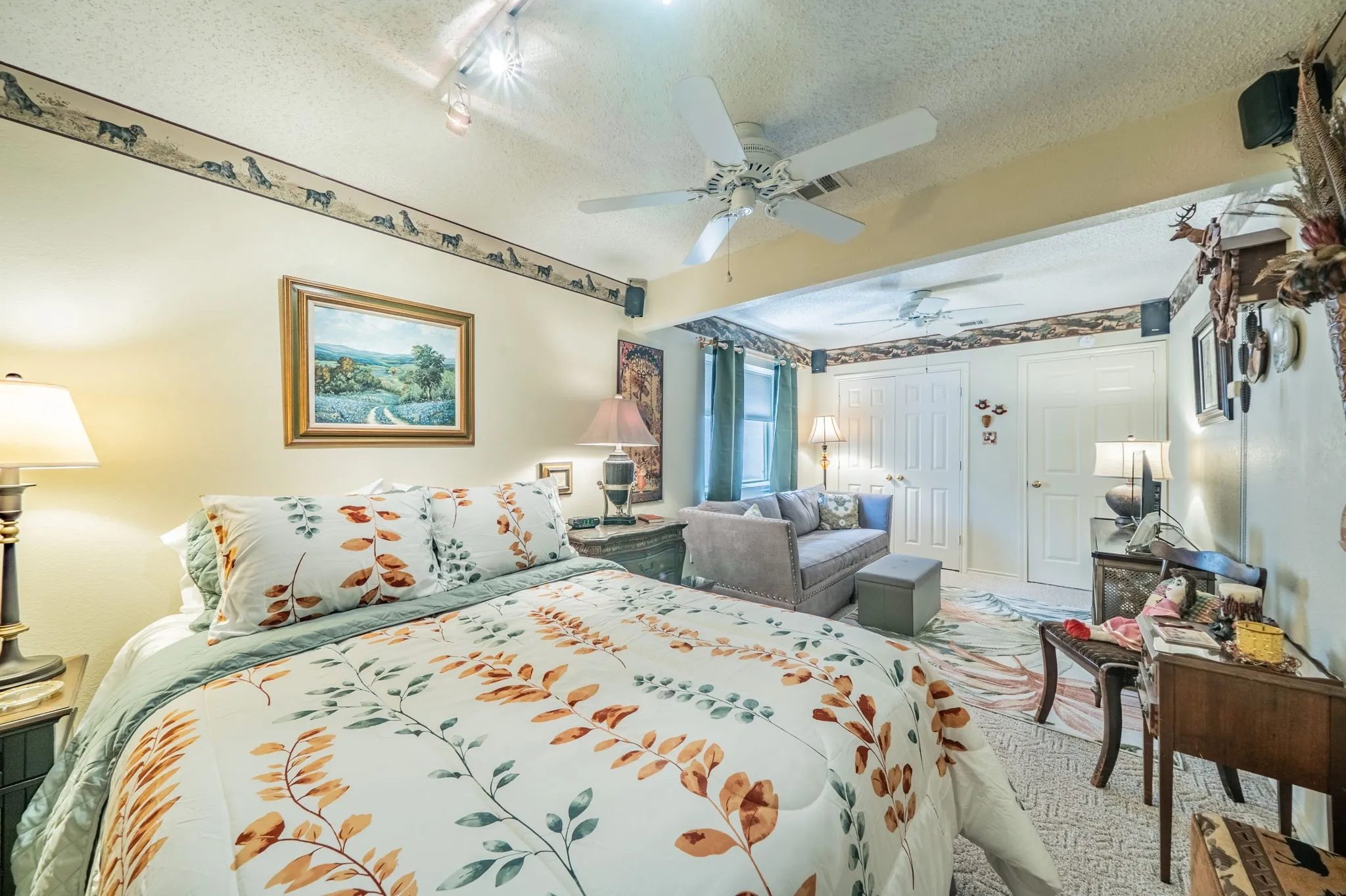 Recessed ceiling lighting, ceiling fan, and painted walls