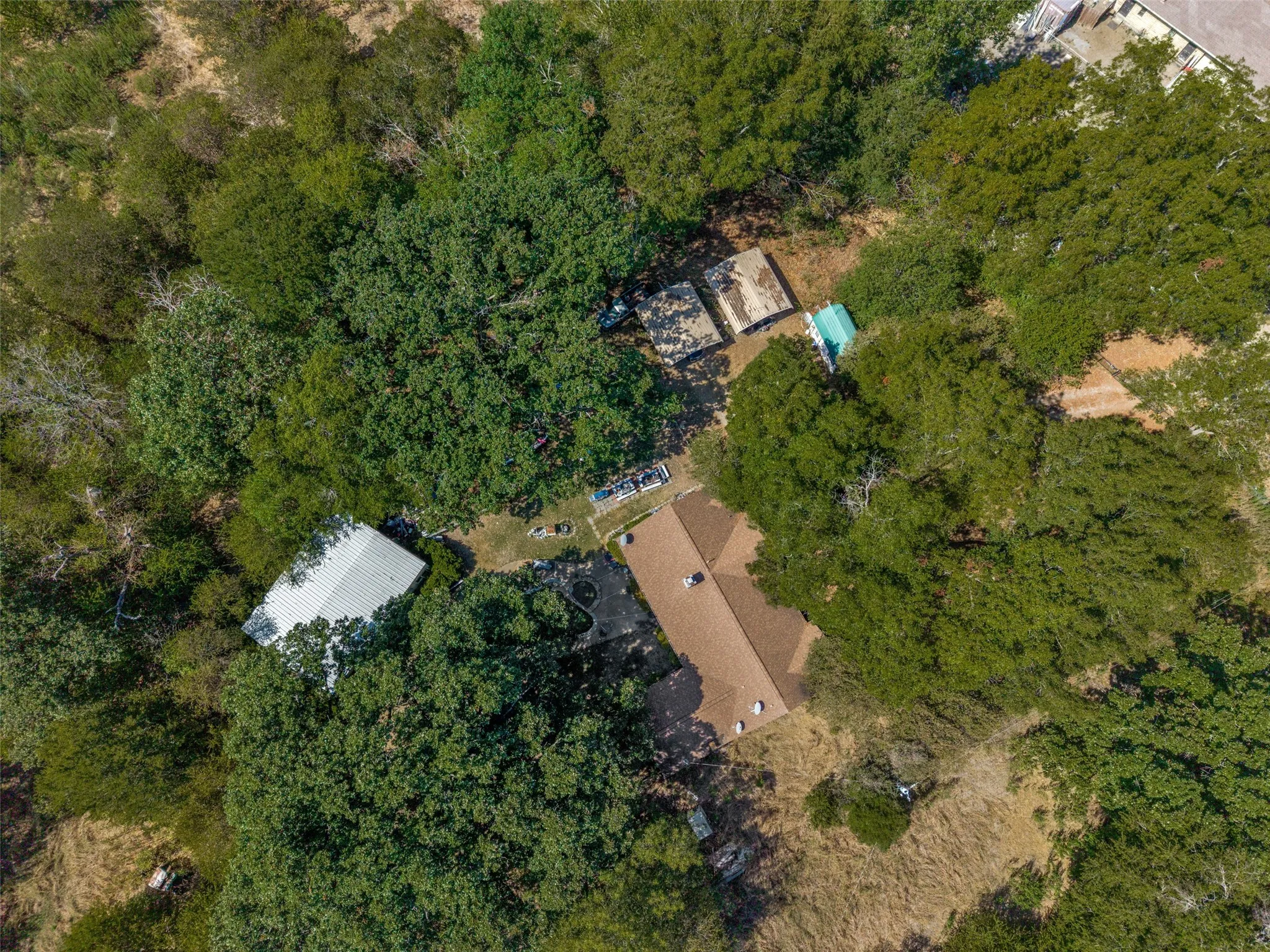 Aerial view of the home, shop and auxiliary buildings.